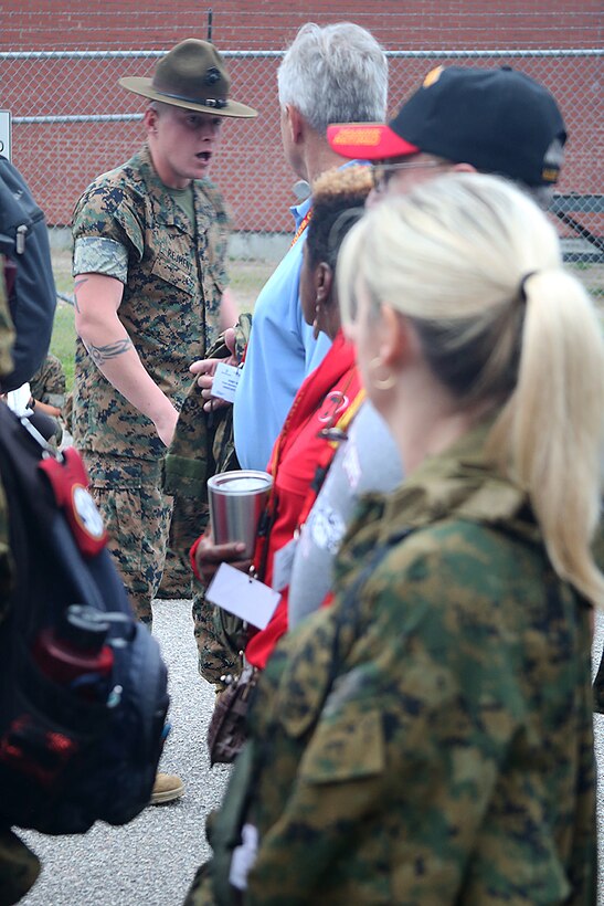 Sgt. Marcin Rejment, drill instructor with 1st Battalion, instructs educators from the greater Montgomery area on how to properly be in a formation aboard Marine Corps Recruit Depot Parris Island, S.C., April 13, 2016. The teachers, coaches, and principals of Recruiting Stations Jacksonville and Montgomery participate in a three-day workshop designed to inform educators about military service and life in the Marine Corps. (Official Marine Corps photo Cpl. John-Paul Imbody)