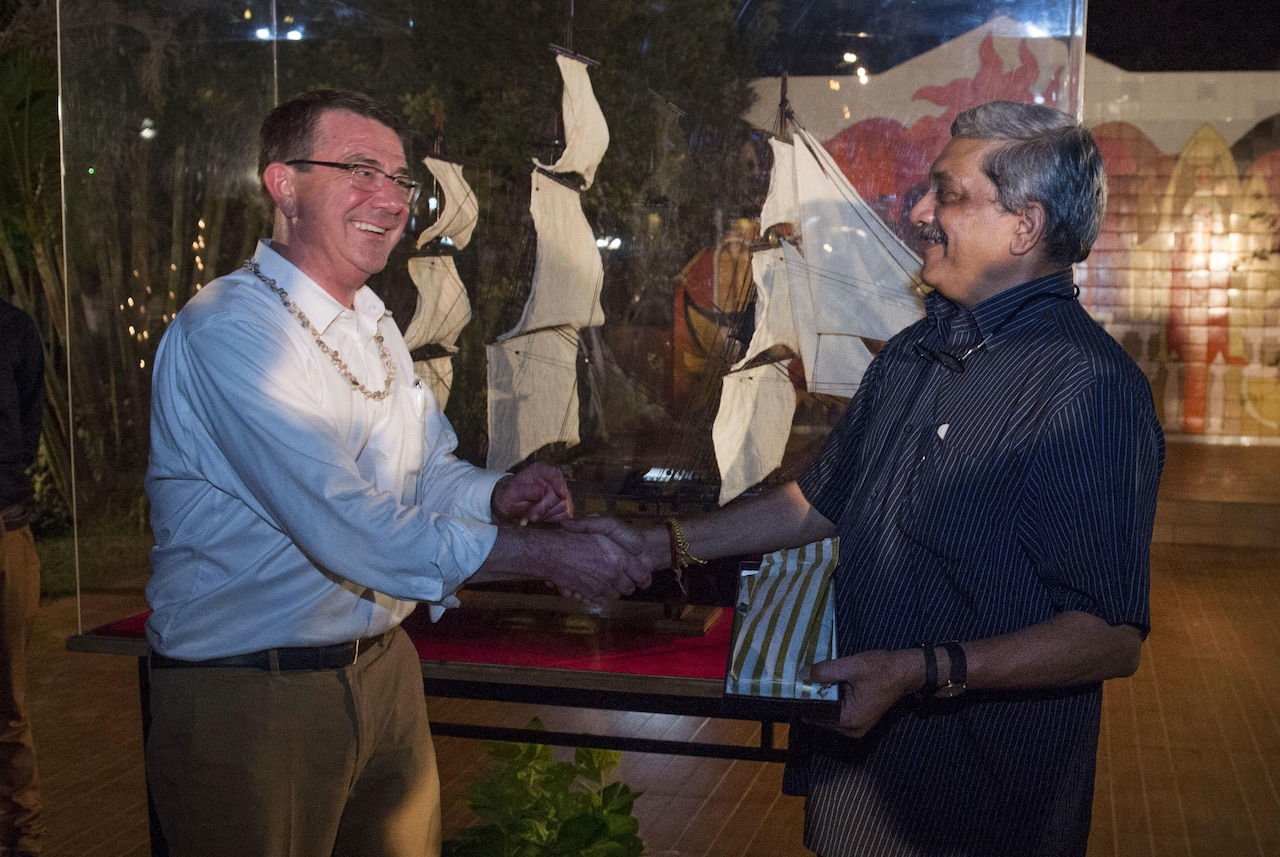 Defense Ash Carter exchanges gifts with Indian Defense Minister Manohar Parrikar following a welcome dinner in Goa, India, April 10, 2016. Carter is visiting India and the Philippines to solidify the rebalance to the Asia-Pacific region. DoD photo by Air Force Senior Master Sgt. Adrian Cadiz