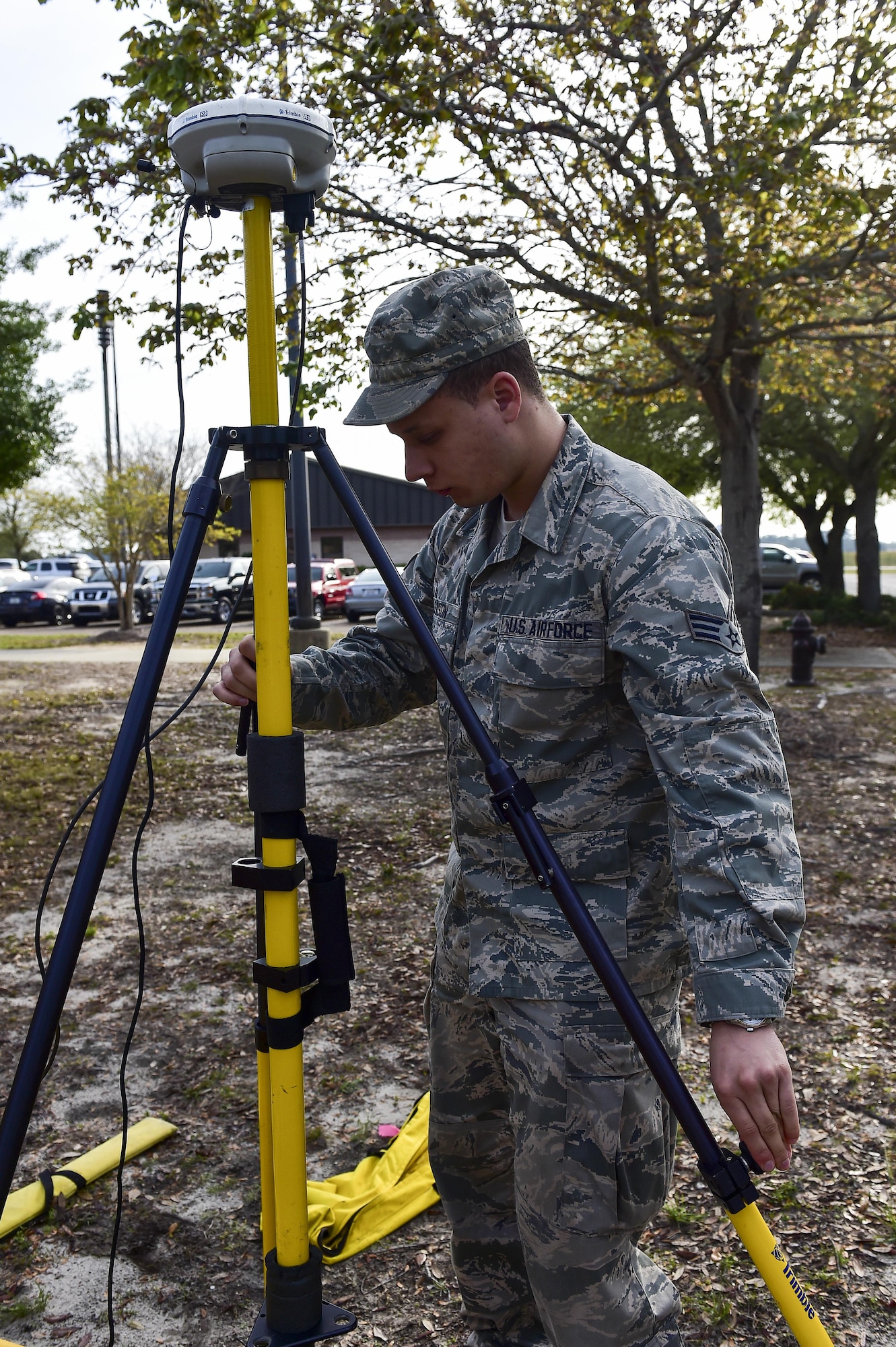 Senior Airman Adam Gleason, an engineering journeyman with the 1st Special Operations Civil Engineer Squadron, levels an R8 receiver for a GPS rover at Hurlburt Field, Fla., March 30, 2016. The GPS rover is used to pinpoint locations on base for surveying potential construction sites or future projects. It can also be used for setting points for airfield boundaries, locations and bare base planning. (U.S. Air Force photo by Senior Airman Jeff Parkinson)