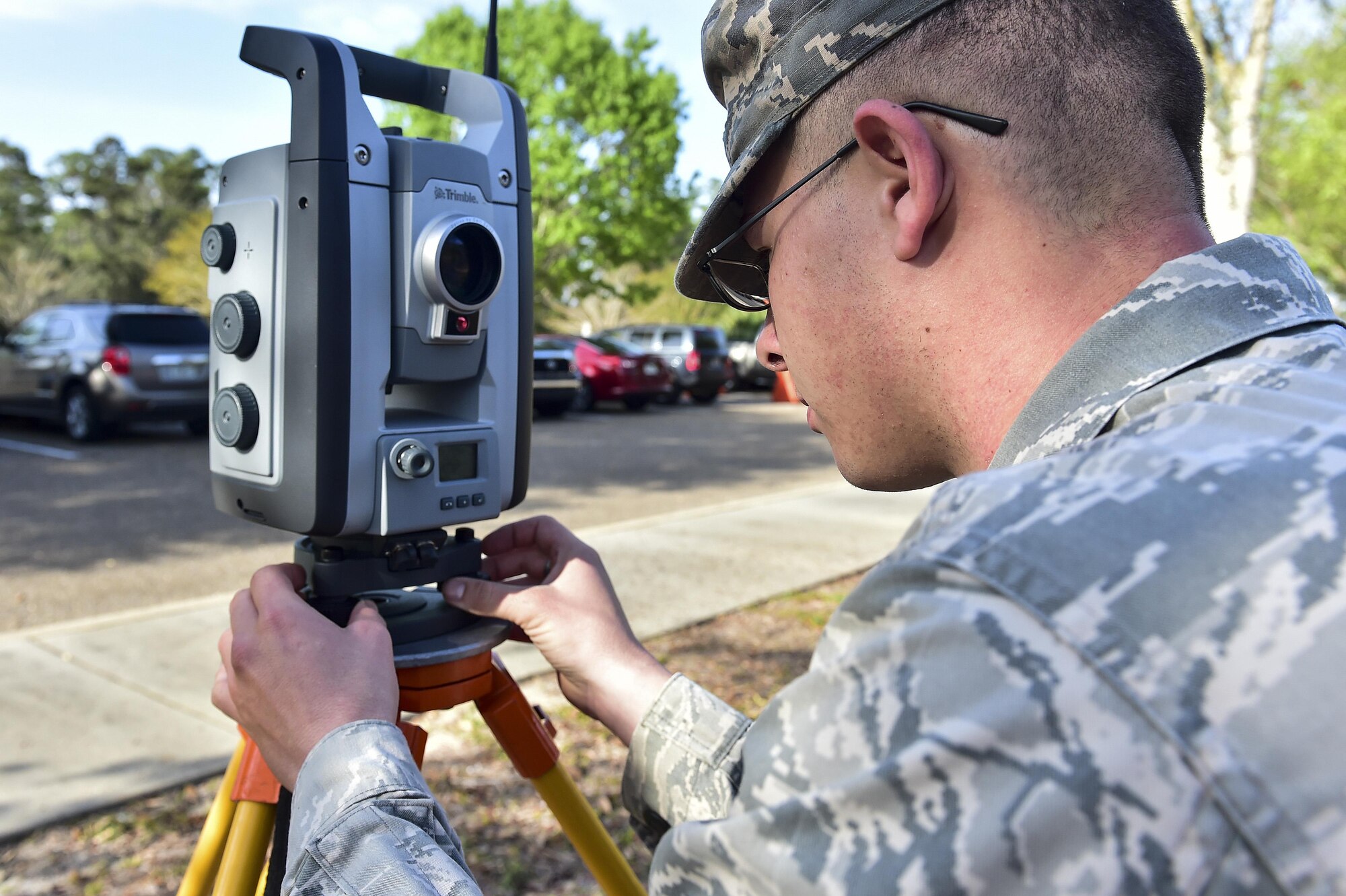 Senior Airman Kirkland Jeffers, an engineering journeyman with the 1st Special Operations Civil Engineer Squadron, levels a VX surveyor at Hurlburt Field, Fla., March 30, 2016. The VX surveyor quickly surveys topography, structures and conditions that affect engineering, design and construction. (U.S. Air Force photo by Senior Airman Jeff Parkinson)