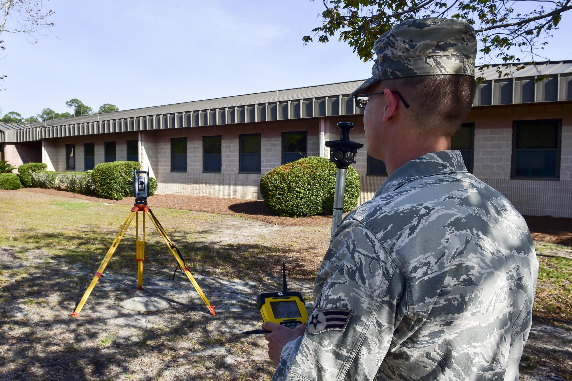 Senior Airman Kirkland Jeffers, an engineering journeyman with the 1st Special Operations Civil Engineer Squadron, uses a VX surveyor’s robotic control at Hurlburt Field, Fla., March 30, 2016. The VX surveyor quickly surveys topography, structures and conditions that affect engineering, design and construction. (U.S. Air Force photo by Senior Airman Jeff Parkinson)