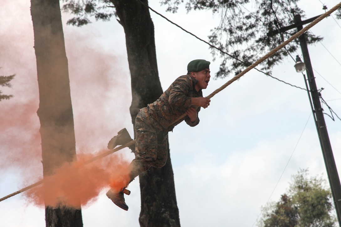 Guatemala Soldier of the Guatemalan Mountain Brigade climb rope across the field to start the Beyond The Horizon Opening Ceremony in San Marcos, Guatemala on April 7, 2016 as a part of Beyond The Horizon 2016 Guatemala. Task Force Red Wolf and Army South conducts Humanitarian Civil Assistance Training to include tactical level construction projects and Medical Readiness Training Exercises providing medical access and building schools in Guatemala with the Guatemalan Government and non-government agencies from 05MAR16 to 18JUN16 in order to improve the mission readiness of US Forces and to provide a lasting benefit to the people of Guatemala. (U.S. Army photo by Sgt. Ronquel Robinson/Released)