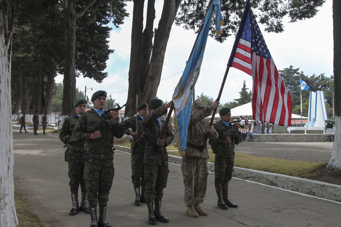 U.S. Army  Sgt. 1st Class Michael Adkins of the 130th Engineer Support Company, present the U.S. flag with members of the Guatemalan Mountain Brigade at the Beyond The Horizon Opening Ceremony in San Marcos, Guatemala on April 7, 2016 as a part of Beyond The Horizon 2016 Guatemala. Task Force Red Wolf and Army South conducts Humanitarian Civil Assistance Training to include tactical level construction projects and Medical Readiness Training Exercises providing medical access and building schools in Guatemala with the Guatemalan Government and non-government agencies from 05MAR16 to 18JUN16 in order to improve the mission readiness of US Forces and to provide a lasting benefit to the people of Guatemala. (U.S. Army photo by Sgt. Ronquel Robinson/Released)