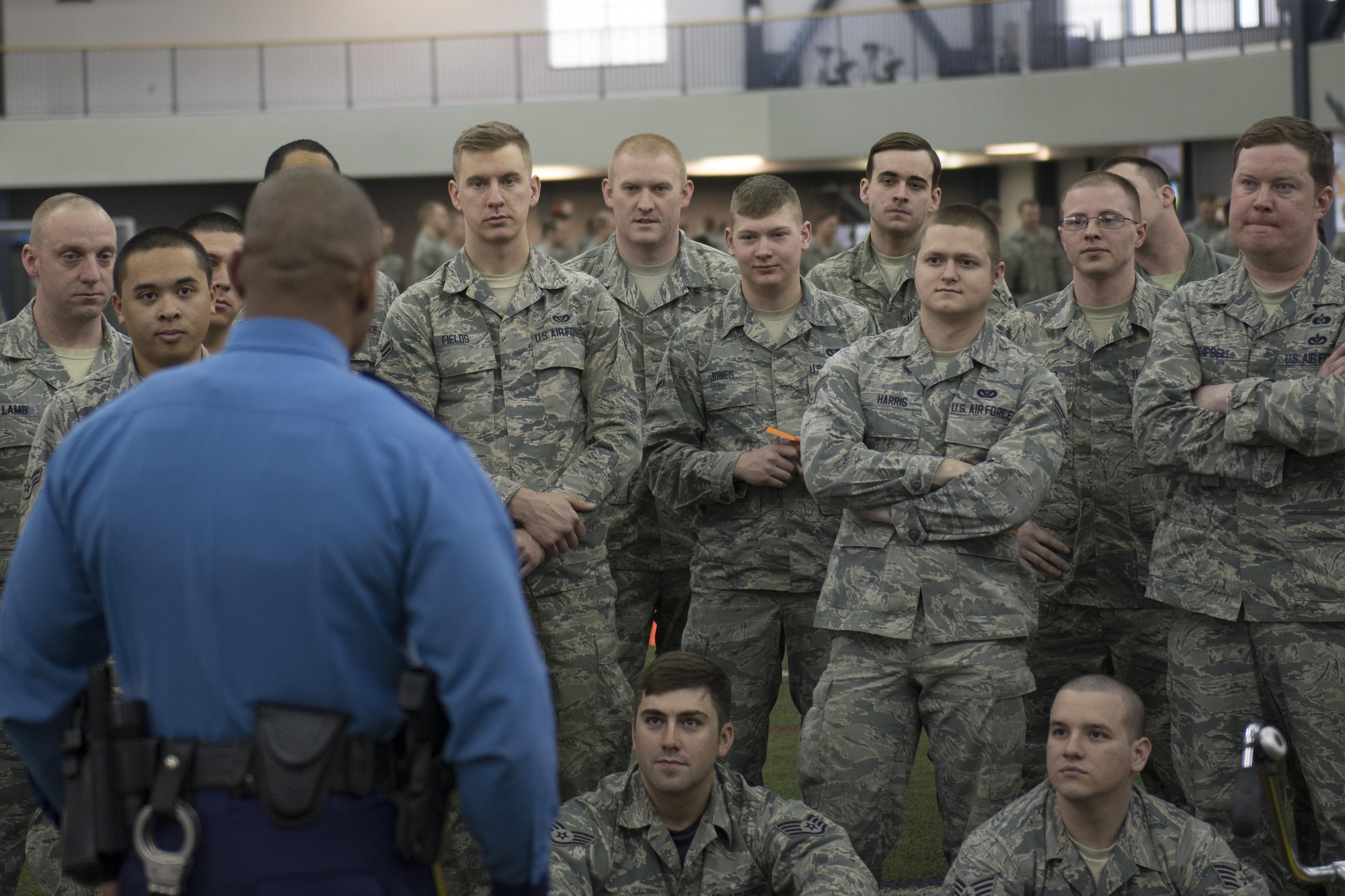 An Alaska State Trooper officer explains the consequences of drinking and driving to members of the 354th Fighter Wing April 8, 2016, on Eielson Air Force Base, Alaska. The event had four stations offering an educational look at the various effects alcohol has on the body and ultimately an Airman’s career. (U.S. Air Force photo by Staff Sgt. Joshua Turner/Released)