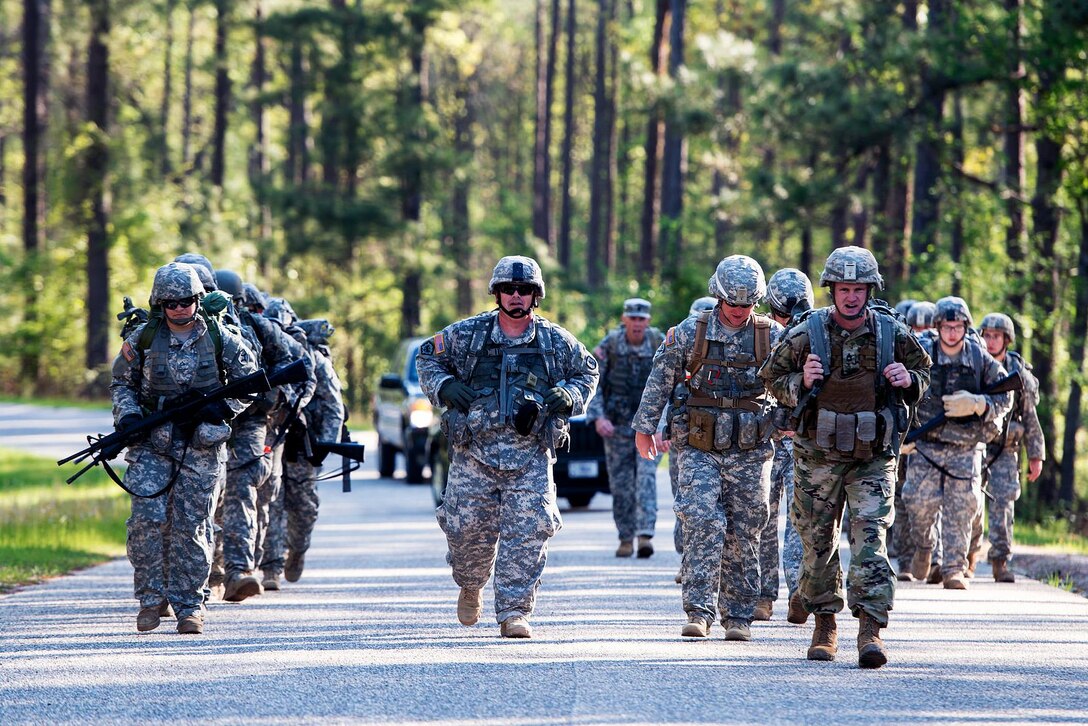 Soldiers conduct a 12-mile ruck march at McCrady Training Center, in Eastover, S.C. April 4, 2016. The soldiers are assigned to the Florida and South Carolina Army National Guard’s 218th Regiment. The Florida Guardsmen are retraining and transitioning to become combat engineers. South Carolina Air National Guard photo by Tech. Sgt. Jorge Intriago