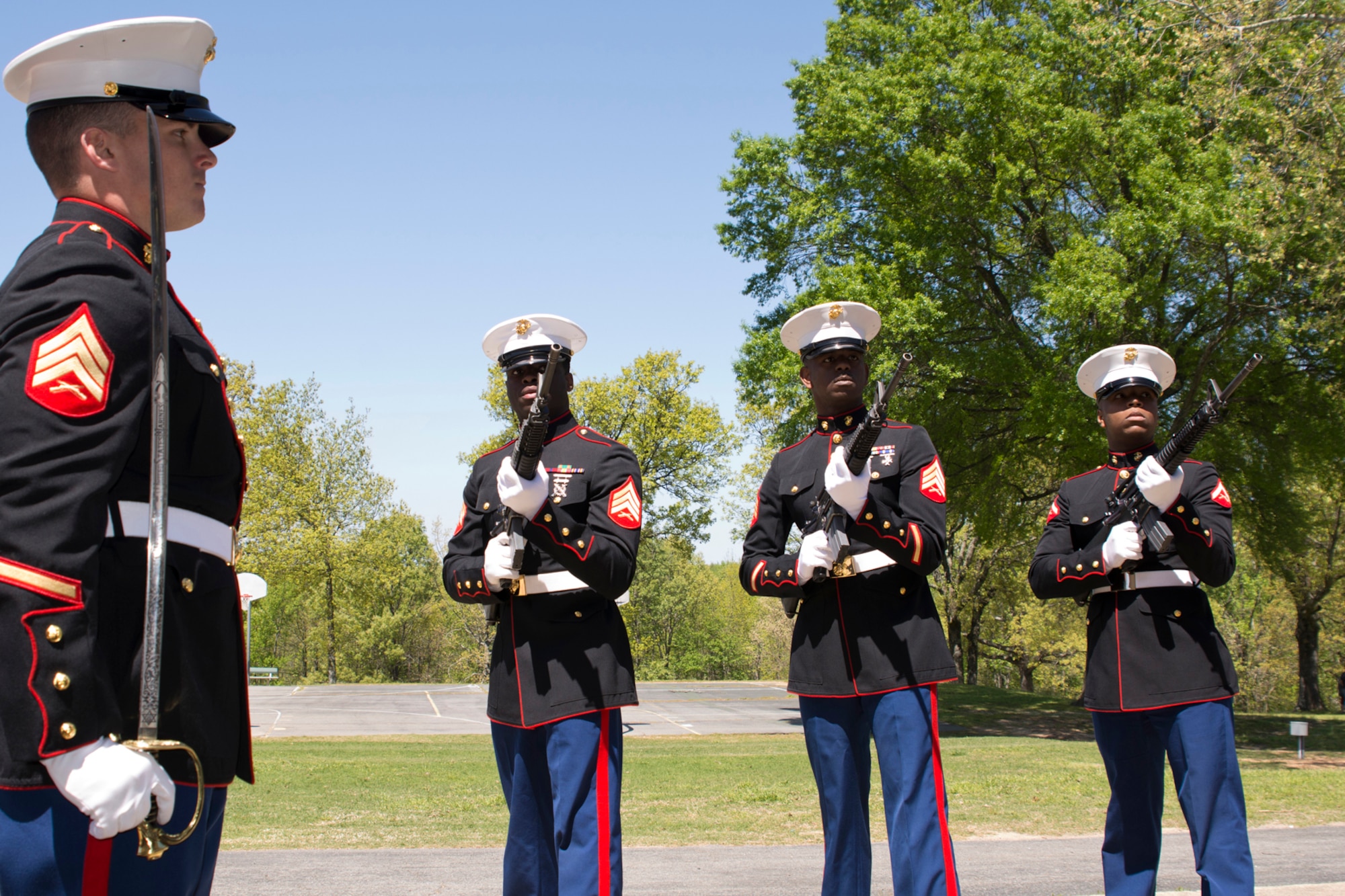 (L-R) U.S. Marine Sgts. Blake Decarlo, Jovious Wade, Frankie Ezell and Lance Cpl. Keithen Parys, prepare to perform a 3-volley rifle salute at the conclusion of the 11th Annual Tribute to Fallen Heroes Ceremony in Sherwood, Ark., Apr. 9, 2016.  The Marines are assigned to India Company, 3rd Battalion, 23rd Marines, 4th Marine Division United States Marine Corp, Camp Pike, North Little Rock, Ark. (U.S. Air Force photo by Master Sgt. Jeff Walston/released) 