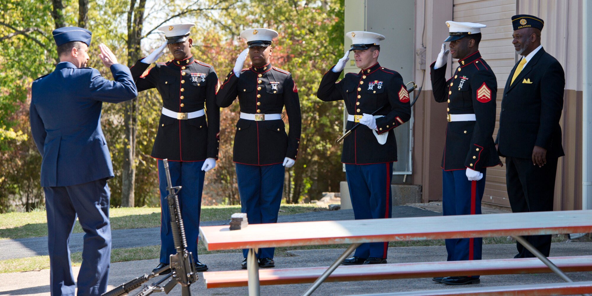 U.S. Air Force Reserve Col. Craig Drescher, commander, 913th Airlift Group, introduces himself to members of the I & I Honors Team at the 11th Annual Tribute to Fallen Heroes Ceremony in Sherwood, Ark., Apr. 9, 2016.  Drescher was a featured speaker at the event. The Marines, assigned to India Company, 3rd Battalion, 23rd Marines, 4th Marine Division United States Marine Corp, Camp Pike, North Little Rock, Ark., fired the 3-volley salute to close out the ceremony. (U.S. Air Force photo by Master Sgt. Jeff Walston/released) 