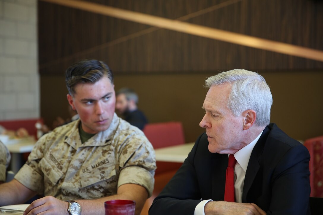 MARINE CORPS BASE CAMP PENDLETON, Calif. – Corporal Austin C. Fredrickson, an intelligence specialist with 1st Reconnaissance Battalion, left, talks with Secretary of the Navy, the Honorable Mr. Ray Mabus, during a luncheon at Camp Pendleton April 12, 2016. Mabus visited Marines and sailors to discuss his intent and expectations for gender integration within combat roles across the Navy and Marine Corps. The Marine Corps remains committed to sustaining and improving its combat effectiveness. (U.S. Marine Corps Photo By: Cpl. Garrett White/ Released)