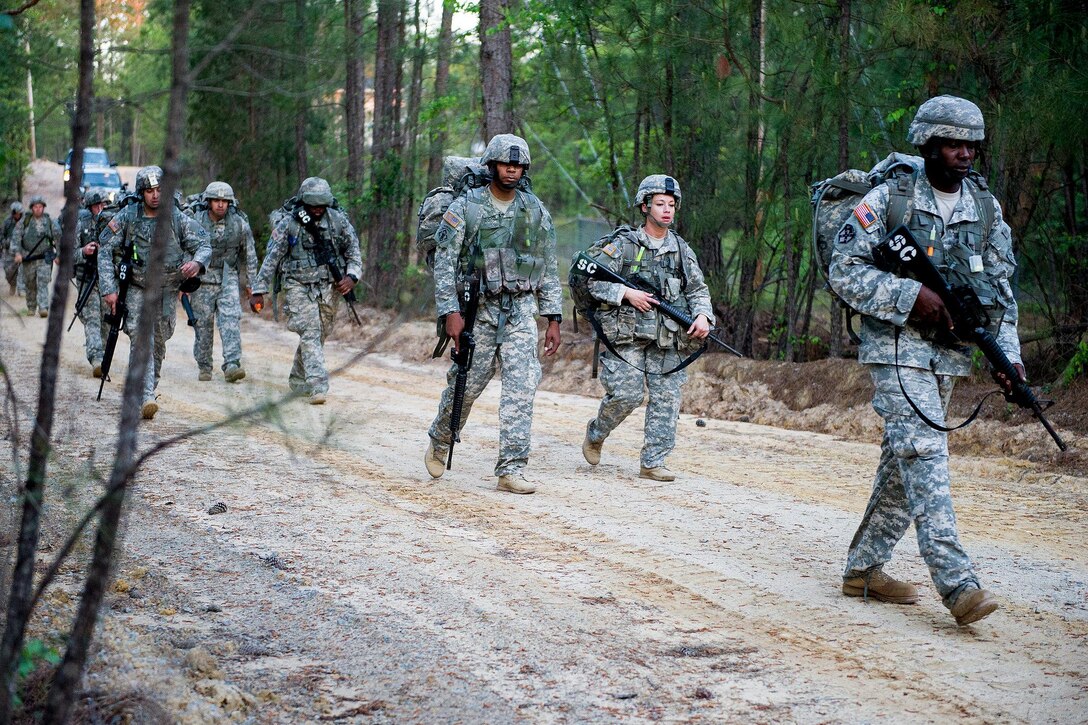 Soldiers participate in a 12-mile ruck march part of a transitioning program to become combat engineers at McCrady Training Center, in Eastover, S.C. April 4, 2016. South Carolina Air National Guard photo by Tech. Sgt. Jorge Intriago