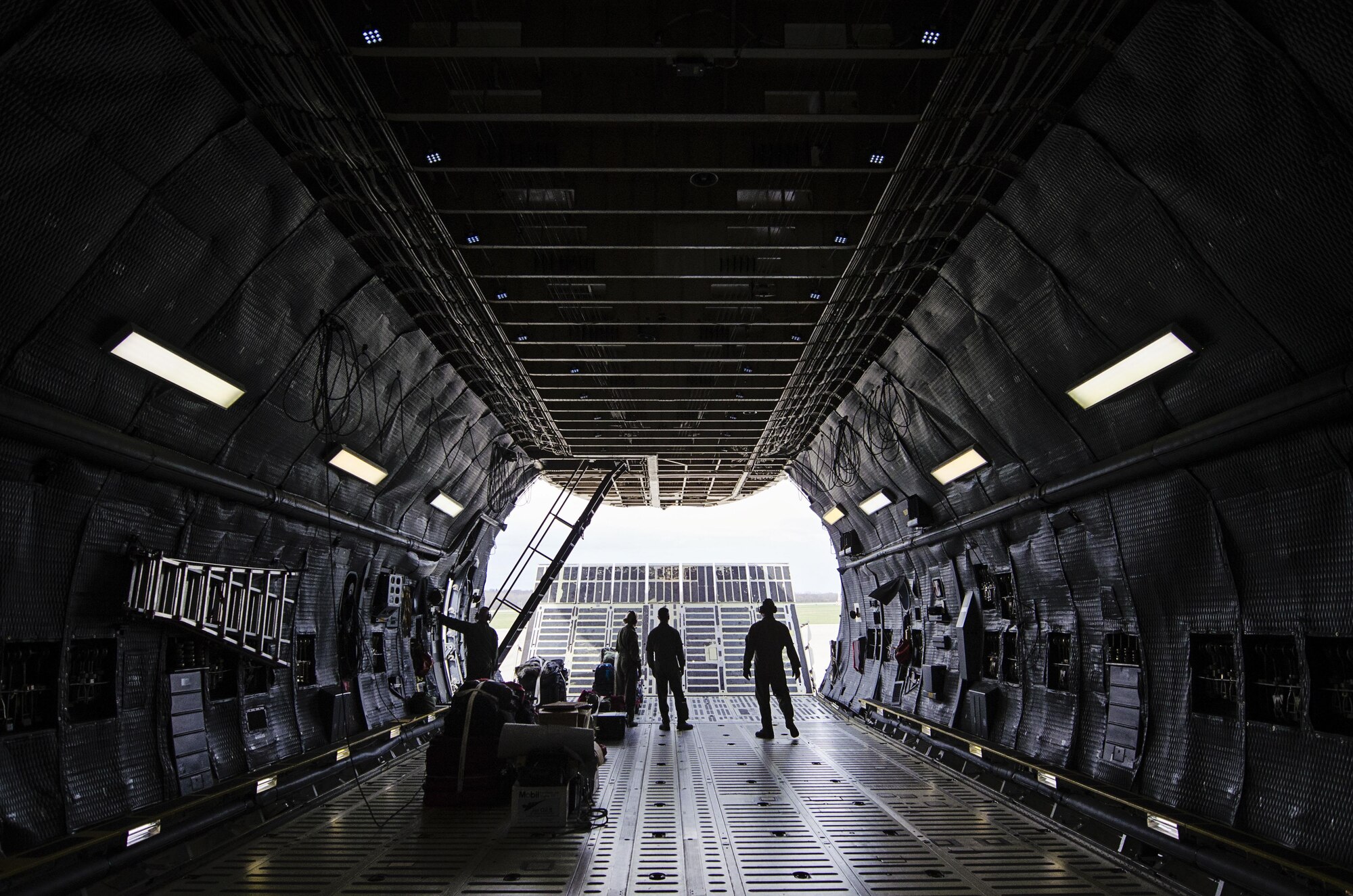 Reserve loadmasters from the 709th Airlift Squadron, Dover Air Force Base, Del., open the nose door of a C-5M Super Galaxy March 30, 2016, at Wright Patterson Air Force Base, Ohio, before loading equipment and flying to an off-station training exercise at Naval Air Station Pensacola, Fla. Dover reservists from 14 different career fields trained in mission readiness and combat related areas March 29 through April 3 to ensure they are current in all their deployment requirements. (U.S. Air Force photo/Capt. Bernie Kale)