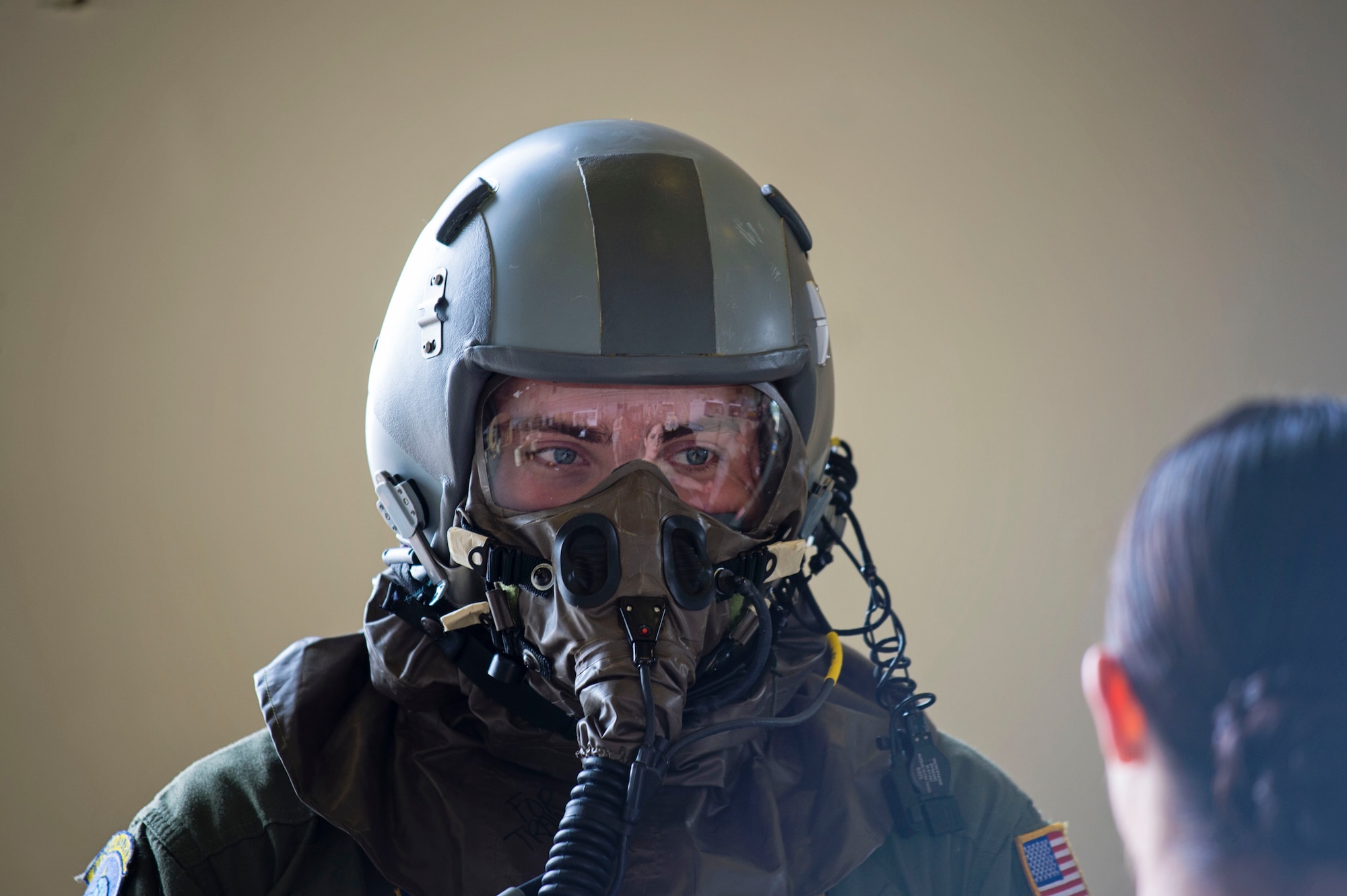 Senior Airman Jake Voshell, a loadmaster with the 709th Airlift Squadron, receives instruction from Staff Sgt. Brittany Toth, from the 436th Airlift Wing, on how to execute the mission in a simulated chemically hazardous area, April 1, 2016, at Naval Air Station Pensacola, Fla. Aircrews from Dover Air Force Base, Del., in the 512th Airlift Wing, conducted an off-station training exercise March 29 through April 3 to ensure they are current in all their deployment requirements. (U.S. Air Force photo/Capt. Bernie Kale)