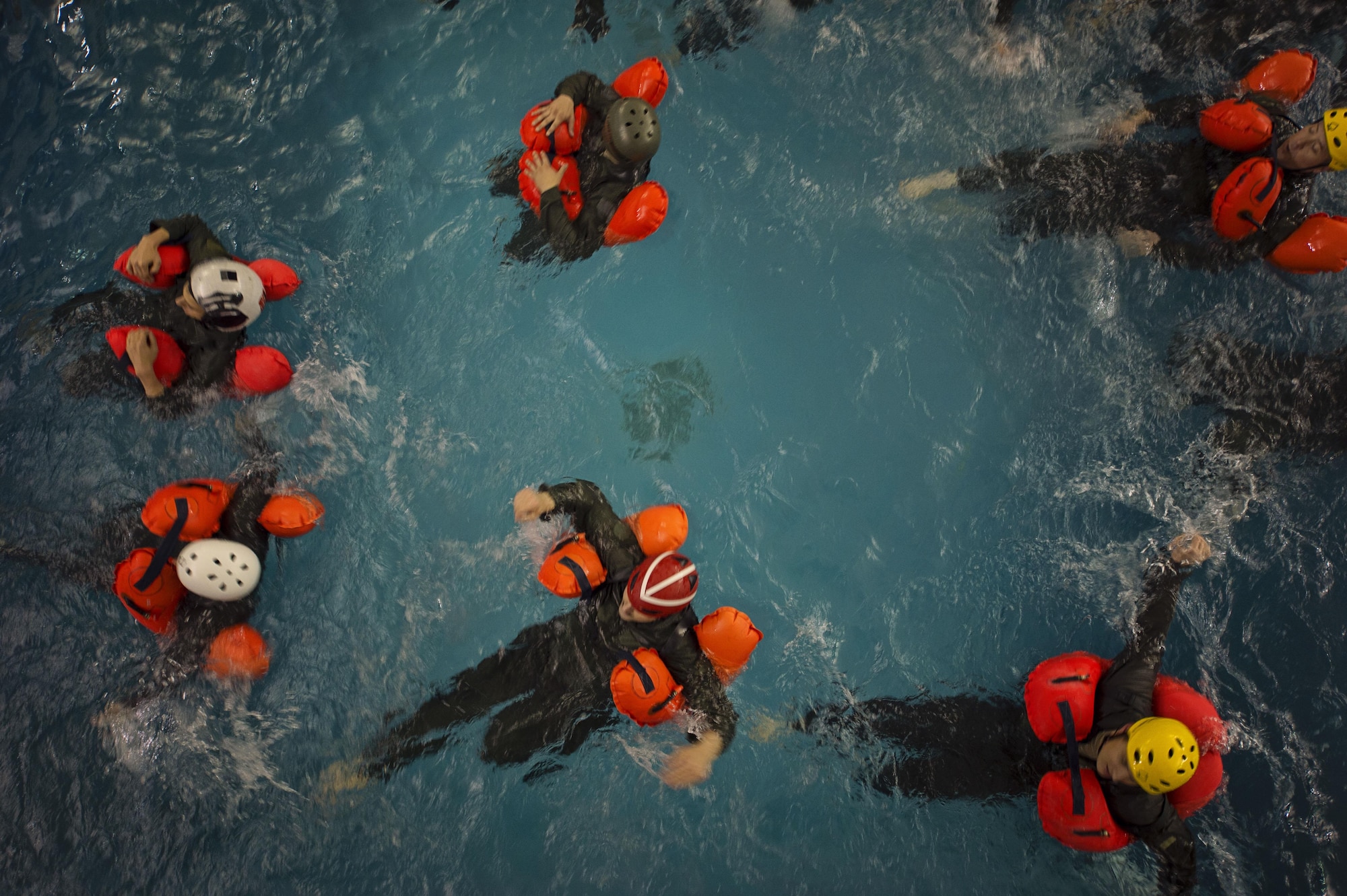 Aircrew from the 709th Airlift Squadron tread water during their water survival portion of their recurring training, April 1, 2016, at Naval Air Station Pensacola, Fla. Reservists from Dover Air Force Base, Del., in the 512th Airlift Wing, conducted an off-station training exercise March 29 to April 3 to ensure they are current in all their deployment requirements. (U.S. Air Force photo/Capt. Bernie Kale)