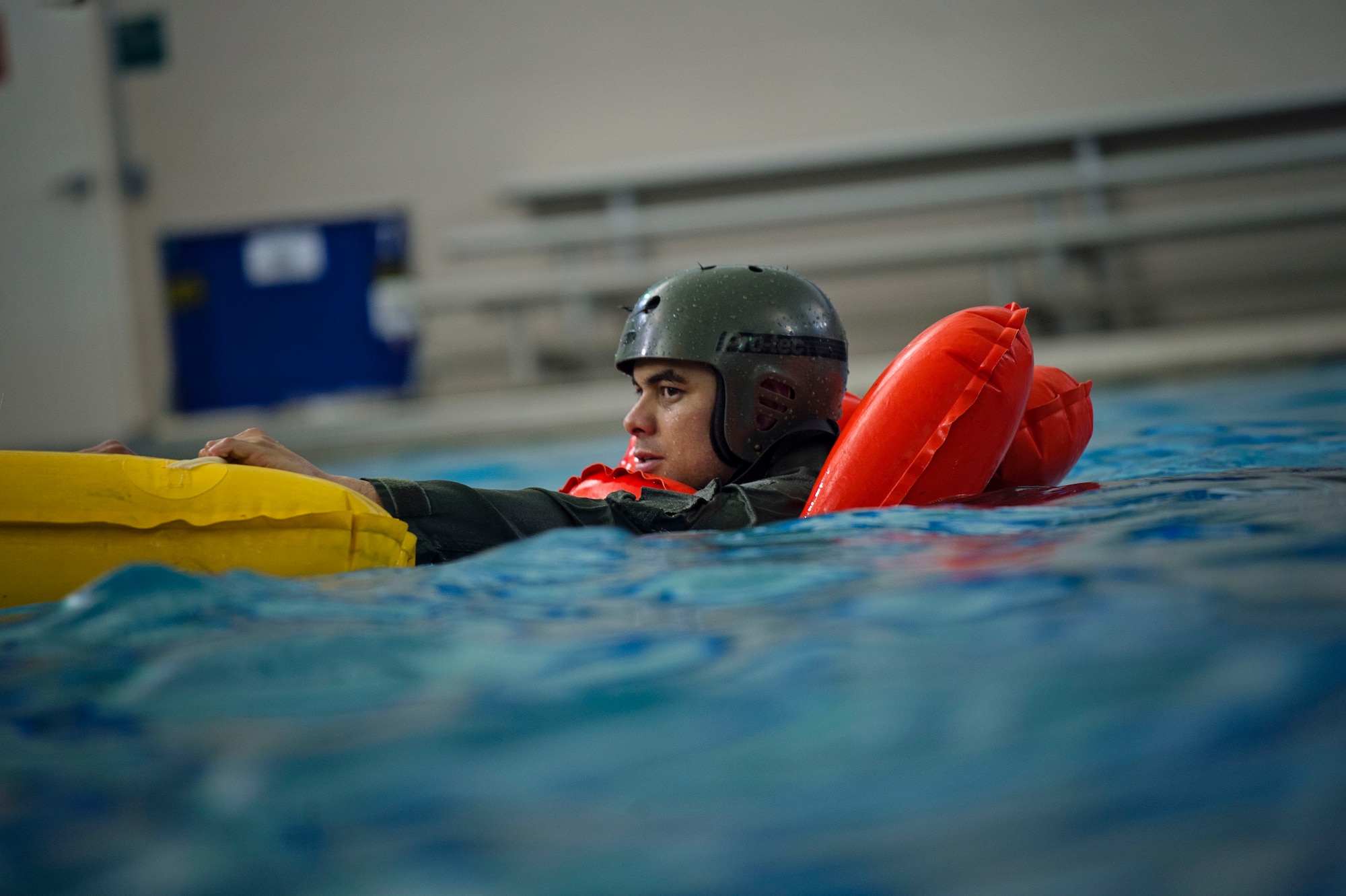 Tech. Sgt. Richard Claycomb, a flight engineer with the 709th Airlift Squadron, hangs on to the life raft during water survival training, April 1, 2016, in Pensacola, Fla. Reservists from Dover Air Force Base, Del., in the 512th Airlift Wing, conducted an off-station training exercise at Naval Air Station Pensacola, Fla., March 29 through April 3 to ensure they are current in all their deployment requirements. (U.S. Air Force Photo/Capt. Bernie Kale)