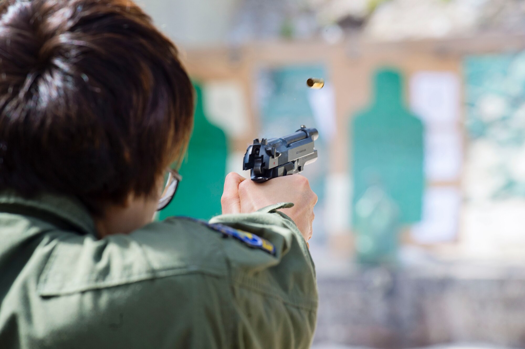 Tech. Sgt. Carolina Rodriquez, a loadmaster for the 709th Airlift Squadron, fires a 9mm pistol down the firing range, April 2, 2016, at Naval Air Station Pensacola, Fla., as part of her deployment recurrency training. Reservists from Dover Air Force Base, Del., in the 512th Airlift Wing, conducted an off-station training exercise, March 29 to April 3, to ensure they are current in all their deployment requirements. (U.S. Air Force photo/Capt. Bernie Kale)