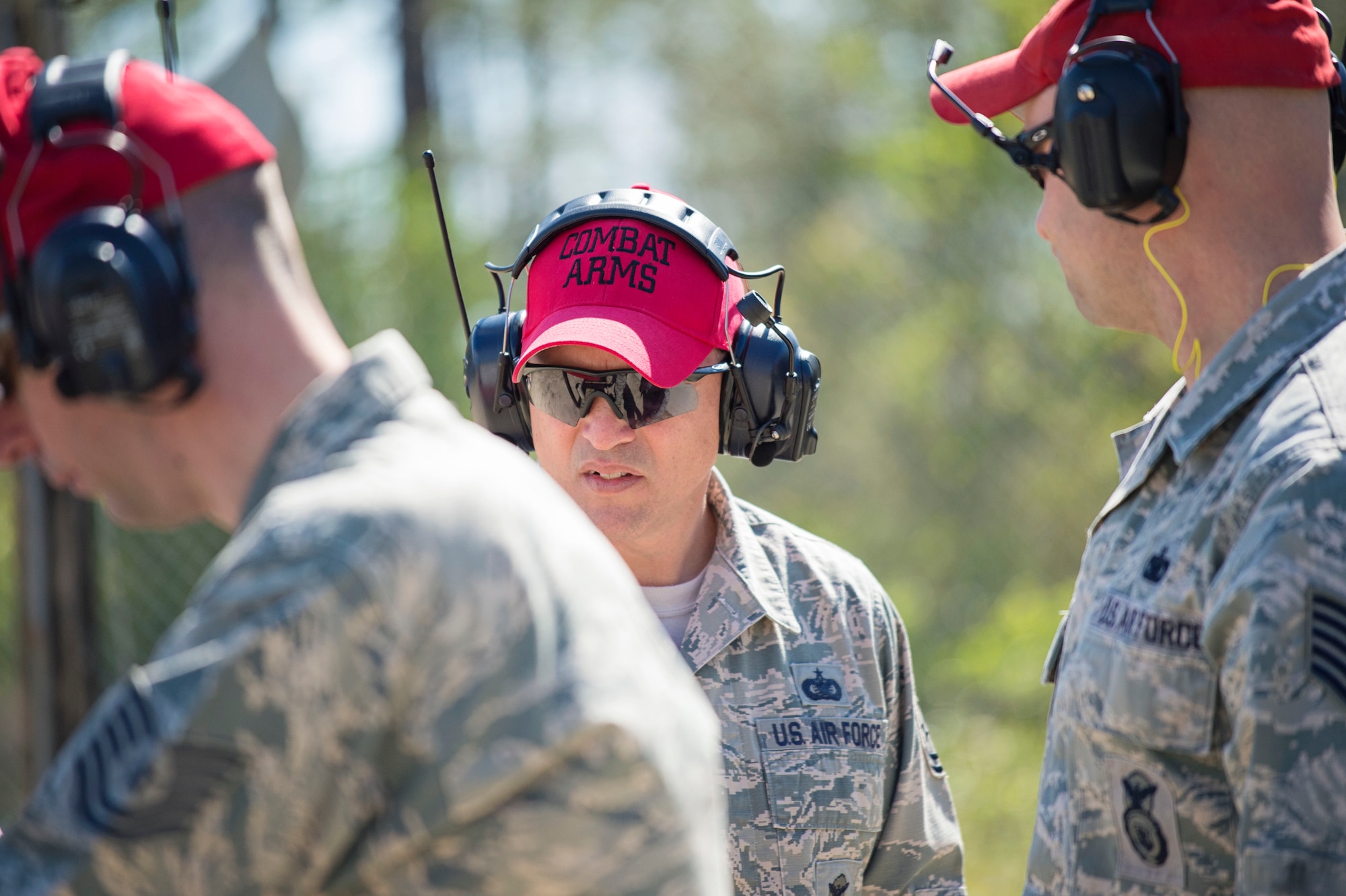Tech. Sgt. Chris Wessel (center), a combat arms instructor for the 512th Security Forces Squadron, performs a safety evaluation with the other instructors on the firing range, April 2, 2016, at Naval Air Station Pensacola, Fla., as part of an aircrew deployment recurrency training event. Instructors from active-duty and Air Force Reserve and the Navy helped provided a seamless, multi-service cadre for the trainees March 29 to April 3, during the training event. (U.S. Air Force photo/Capt. Bernie Kale)