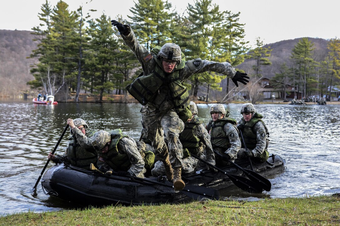 An Army cadet jumps off the front of an inflatable boat during the 2016 Sandhurst Competition at West Point, N.Y., April 9, 2016. The competition tests a team’s ability to perform specified tasks that are both mentally and physically challenging. Army photo by Sgt. 1st Class Brian Hamilton