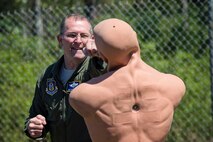 Master Sgt. Matthew Harr, a loadmaster in the 709th Airlift Squadron, punches a torso during combat training, April 2, 2016, at Naval Air Station Pensacola, Fla. Reservists from Dover Air Force Base, Del., conducted an off-station training exercise, March 29 through April 3, to ensure they are current in all their deployment requirements. (U.S. Air Force photo/ Capt. Bernie Kale)