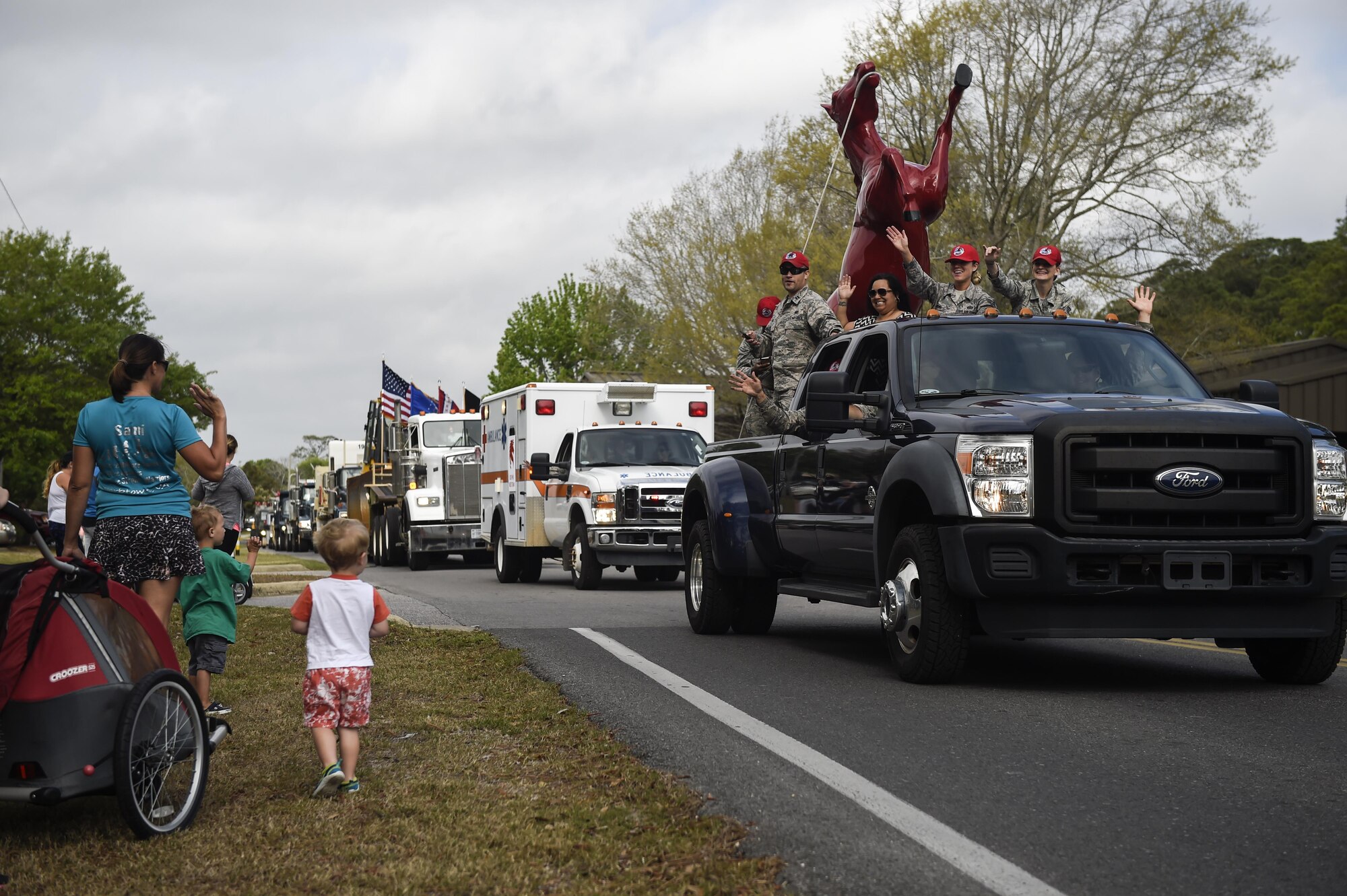 Airmen with the 823rd RED HORSE Squadron celebrate the squadron’s 50th anniversary with a parade and open house at Hurlburt Field, Fla., April 6, 2016. The RED HORSE squadron held an open house at their compound to showcase their mission to family, friends and former RED HORSE members. (U.S. Air Force photo by Airman 1st Class Kai White)