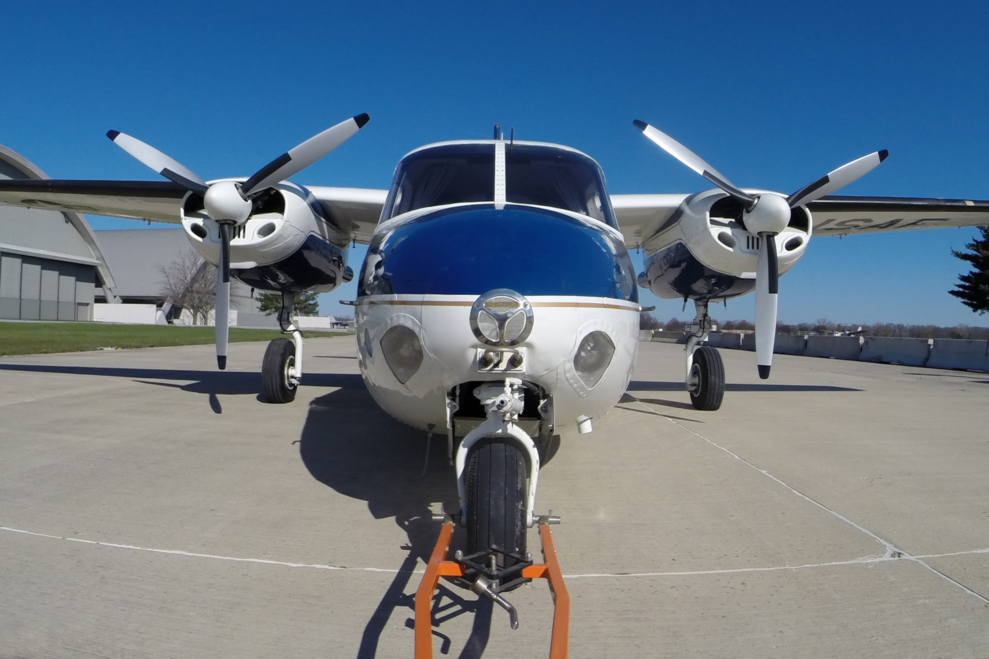 DAYTON, Ohio -- The Aero Commander U-4B being towed into the fourth building at the National Museum of the United States Air Force on April 12, 2016. This aircraft is one of ten Presidential aircraft in the collection. (U.S. Air Force photo by Ken LaRock)