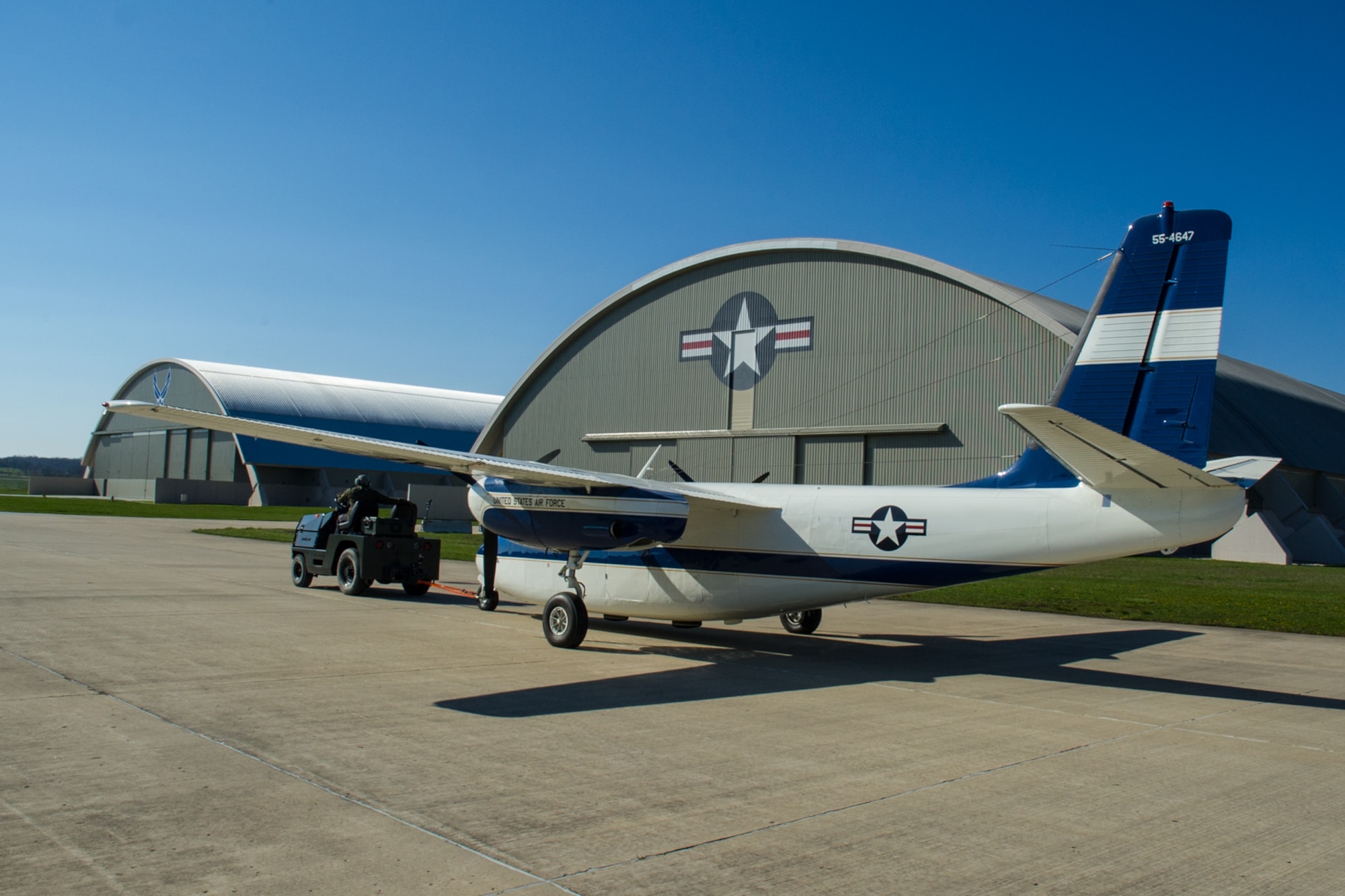 DAYTON, Ohio -- The Aero Commander U-4B being towed into the fourth building at the National Museum of the United States Air Force on April 12, 2016. This aircraft is one of ten Presidential aircraft in the collection. (U.S. Air Force photo by Ken LaRock)