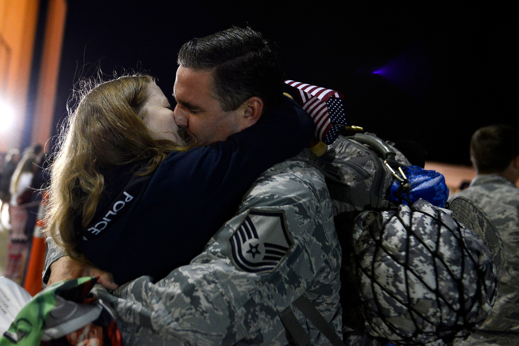 A U.S. Airman assigned to the 20th Fighter Wing kisses his significant other after returning home from a deployment at Shaw Air Force Base, S.C., April 13, 2016. Approximately 300 Airmen returned from a six month deployment to the United States Central Command Area of Responsibility. (U.S. Air Force photo by Airman 1st Class Christopher Maldonado)