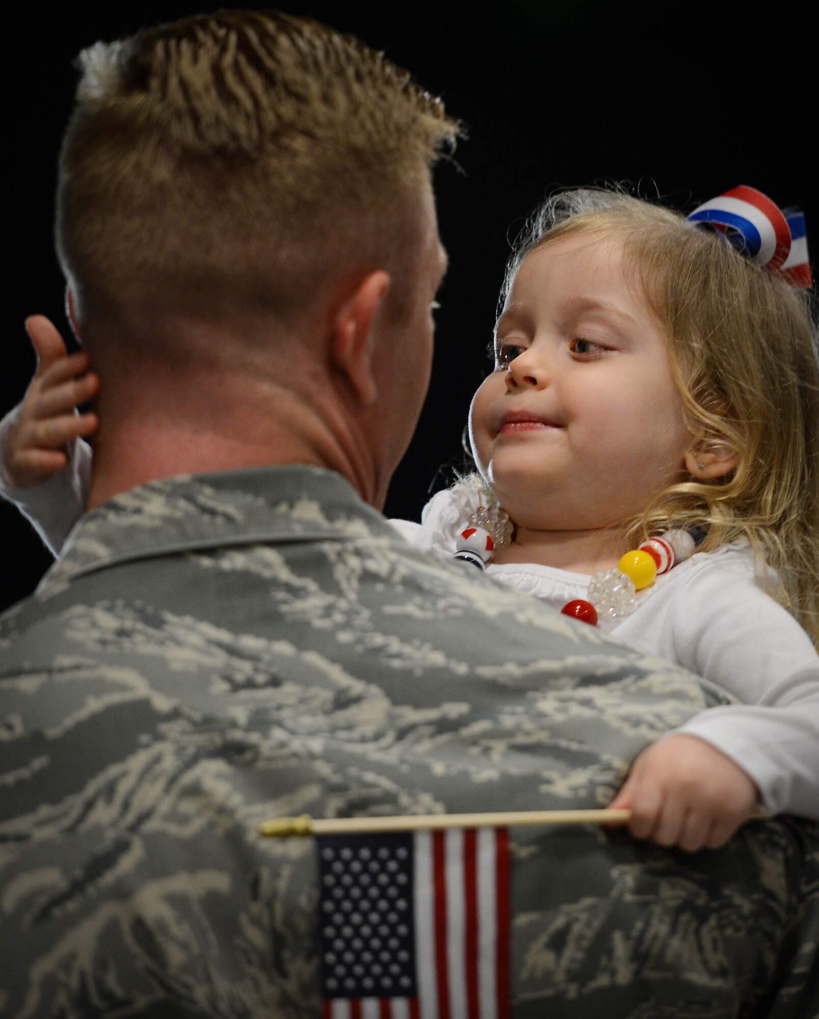 A U.S. Airman assigned to the 20th Fighter Wing is embraced by his daughter after returning to Shaw Air Force Base, S.C., April 13, 2016. Approximately 300 Airmen deployed for six months to the United States Central Command Area of Responsibility. (U.S. Air Force photo by Senior Airman Jensen Stidham)
an Jensen Stidham)
