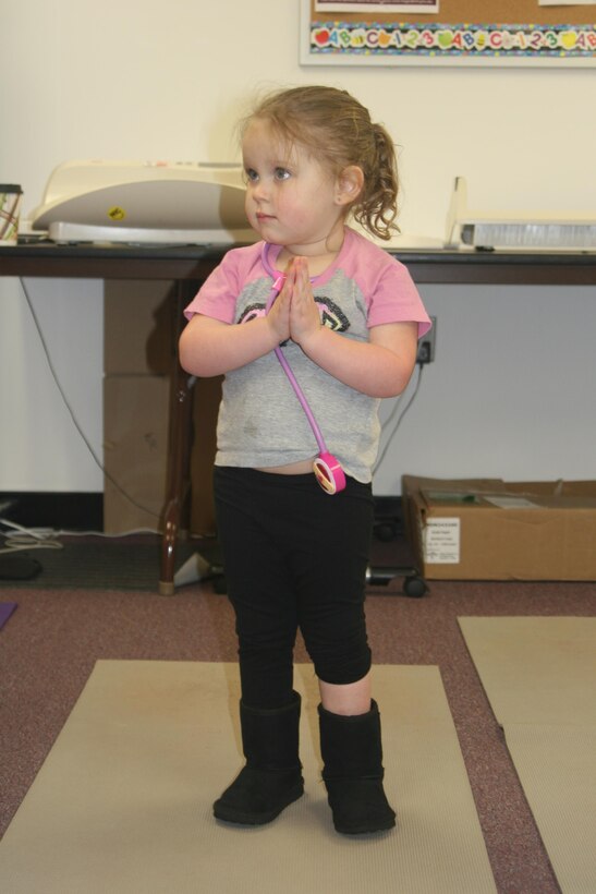 Lily, 3, does some yoga at the New Parent Support Program Open House, held Apr. 8 aboard Marine Corps Base Quantico. At the center of the event was the Teddy Bear Clinic, where children could bring their favorite stuffed animals for a check-up. Other stations highlighted the other resources available to parents and young children aboard base. The event was held in honor of Child Abuse Prevention Month.
