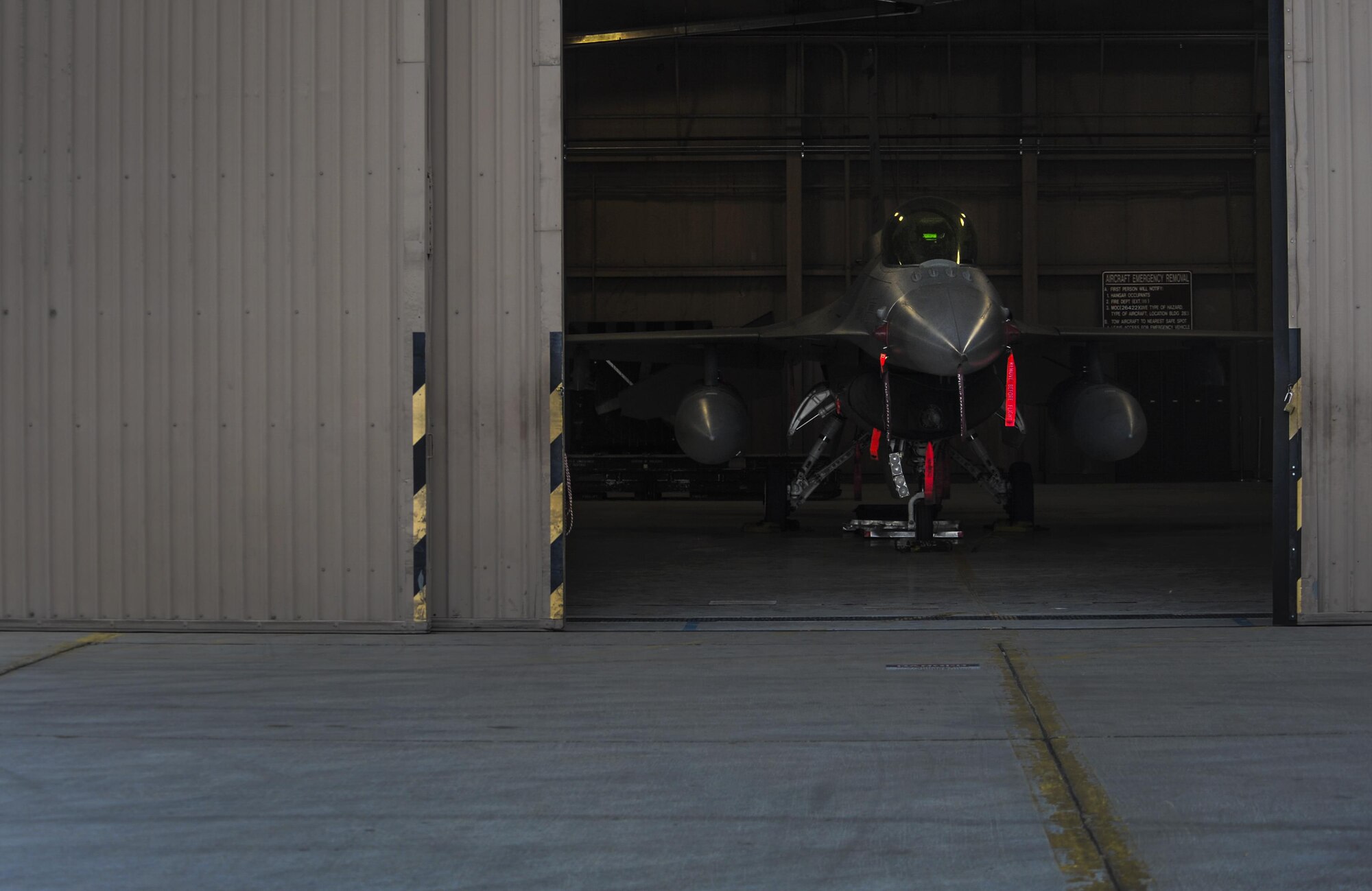 An F-16 Fighting Falcon sits in the hangar after the 57th Wings Load Crew of the Quarter Competition at Nellis Air Force Base, Nev., April 8, 2016. The load crew competition is a quarterly event held at Nellis AFB to highlight the exceptional airmen of the 57th Air Maintenance Squadron. (U.S. Air Force photo by Airman 1st Class Kevin Tanenbaum)