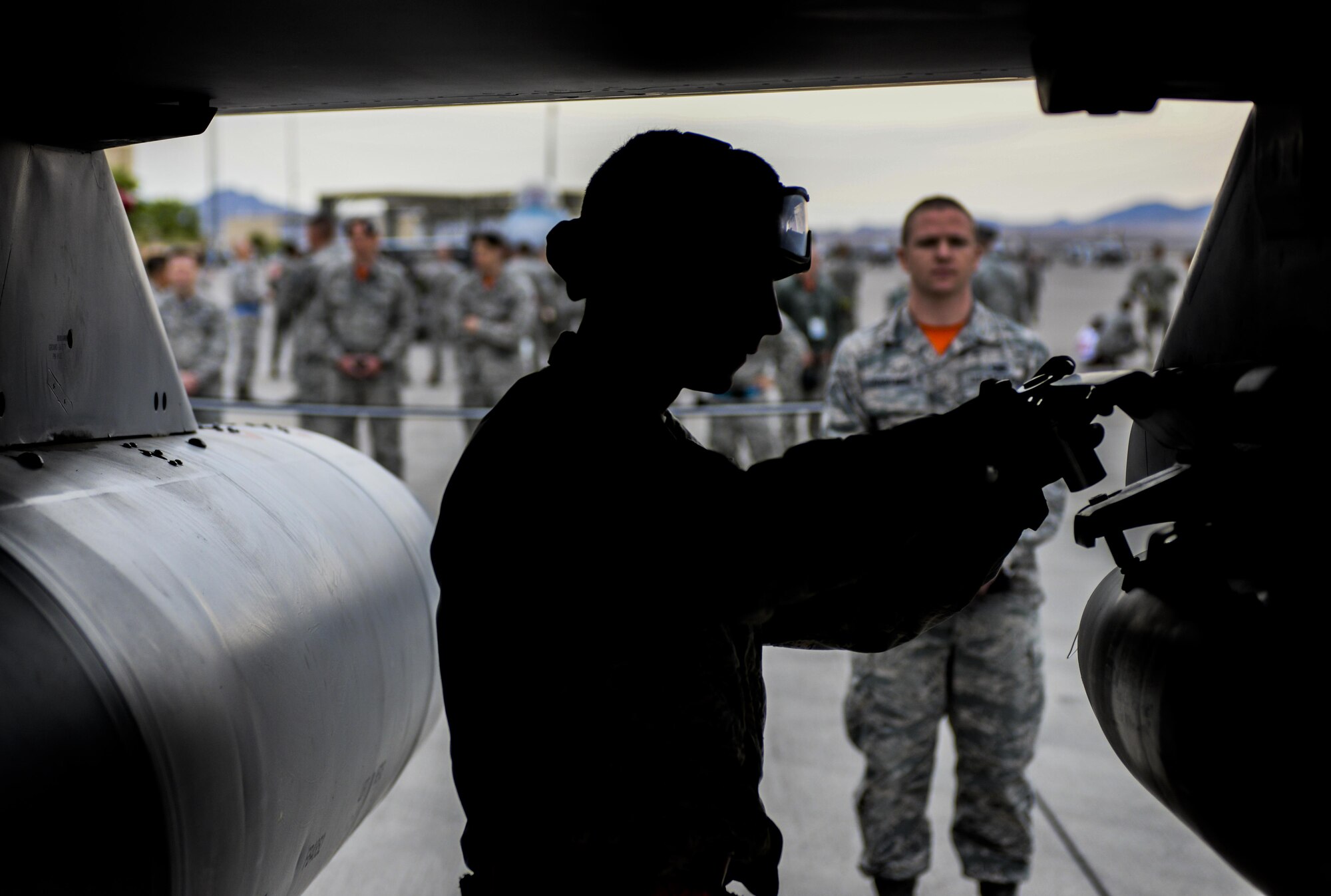 An Airman participates in the 57th Wing Load Crew of the Quarter Competition at Nellis Air Force Base, Nev., April 8, 2016. The competitions give weapons loaders throughout the 57th Maintenance Group the opportunity to display their war-fighting skills to their peers and superiors. (U.S. Air Force photo by Nathan Byrnes)