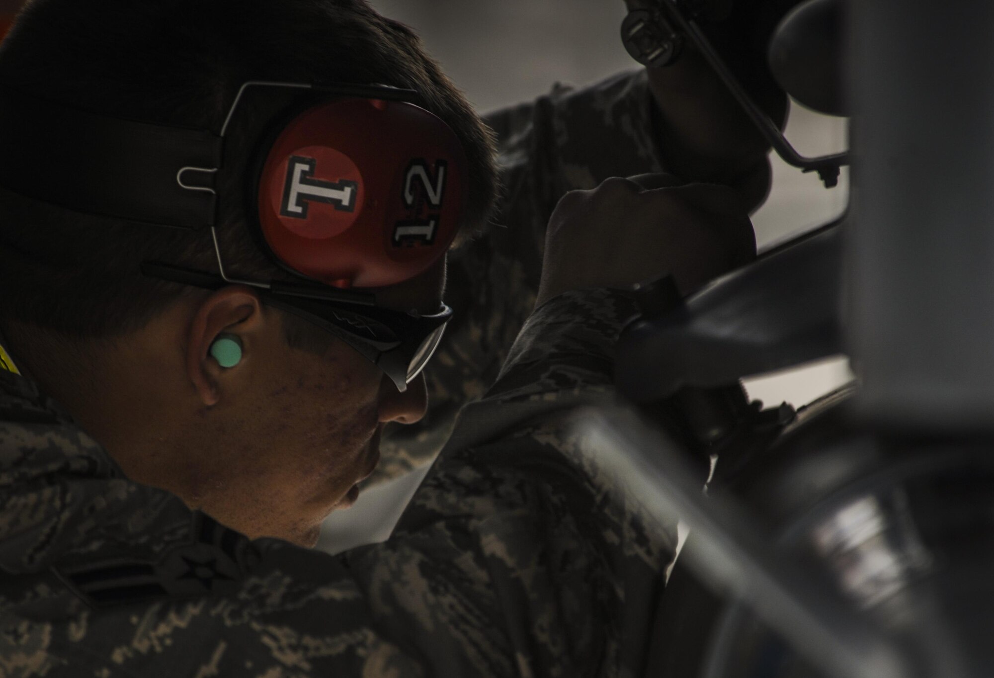 Airman 1st Class Micah Templin, load crew member from Viper AMU, fastens an armament during the the 57th Wings Load Crew of the Quarter Competition at Nellis Air Force Base, Nev., April 8, 2016. Viper AMU is responsible for the aircraft maintenance of the F-16C and F-16D. (U.S. Air Force photo by Airman 1st Class Kevin Tanenbaum)