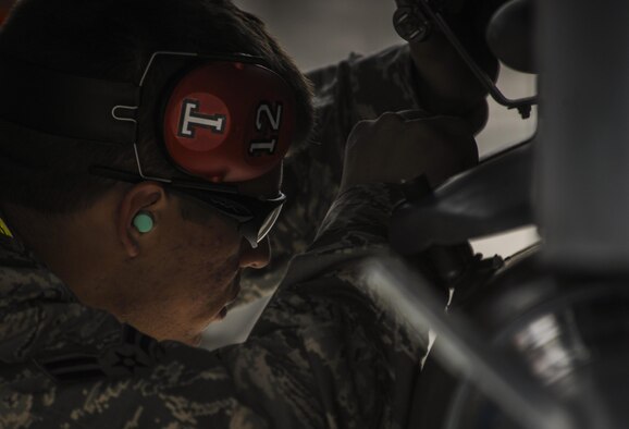 Airman 1st Class Micah Templin, load crew member from Viper AMU, fastens an armament during the the 57th Wings Load Crew of the Quarter Competition at Nellis Air Force Base, Nev., April 8, 2016. Viper AMU is responsible for the aircraft maintenance of the F-16C and F-16D. (U.S. Air Force photo by Airman 1st Class Kevin Tanenbaum)