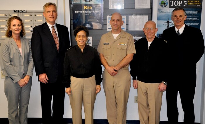 DAHLGREN, Va. (April 12, 2016) - Vice Chief of Naval Operations Adm. Michelle Howard and Naval Surface Warfare Center Dahlgren Division (NSWCDD) Capt. Brian Durant (center) take a break after meetings with senior Navy scientists and engineers.  Howard, Rear Admiral DeWolfe Miller, assistant deputy Chief of Naval Operations (OPNAV) for Warfare Systems, and Claude Barron, OPNAV Assured Command and Control director, received briefs on programs managed by three NSWCDD technical departments: Strategic & Computing Systems Department; Electromagnetic & Sensor Systems Department; and the Gun & Electric Weapon Systems Department. Standing left to right are Meredith Bondurant, NSWCDD chief of staff; Michael Till, NSWCDD acting technical director; Howard; Durant; Miller, and Barron.  