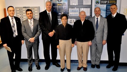 DAHLGREN, Va. (April 12, 2016) - Vice Chief of Naval Operations Adm. Michelle Howard and Rear Admiral DeWolfe Miller, assistant deputy Chief of Naval Operations (OPNAV) for Warfare Systems pause after meetings with senior Navy scientists and engineers.  Howard, Miller, and Claude Barron, OPNAV Assured Command and Control director, received briefs on programs managed by three NSWCDD technical departments: Strategic & Computing Systems Department; Electromagnetic & Sensor Systems Department; and the Gun & Electric Weapon Systems Department. Standing left to right are Jim Yee, NSWCDD acting department head for Gun & Electric Weapon Systems; Dale Sisson, NSWCDD department head for Electromagnetic & Sensor Systems; Kyle Jones, NSWCDD department head for Strategic & Computing Systems; Howard; Miller; Chris Barnes, NSWCDD division head for Electromagnetic Effects, and Barron.  