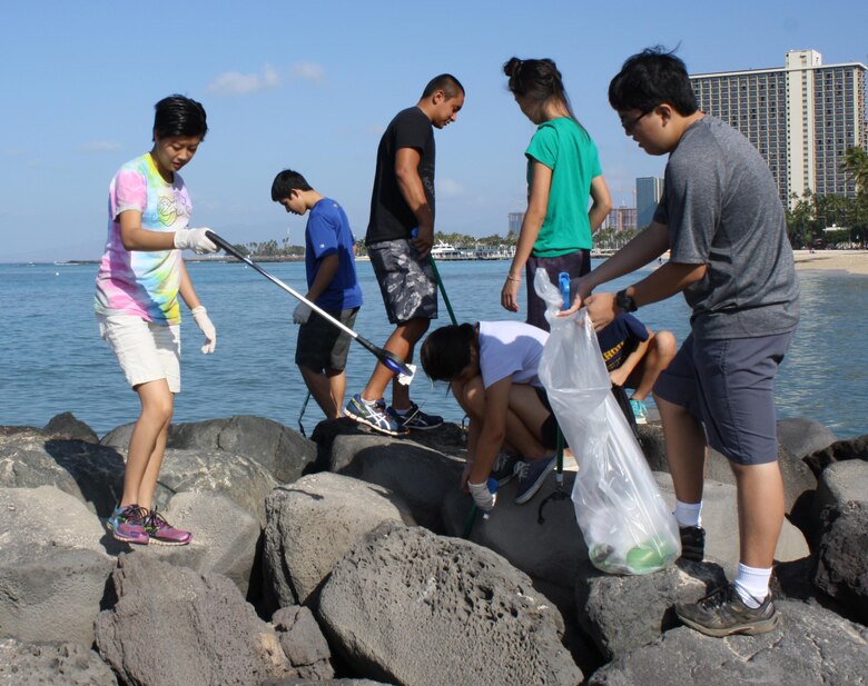 Student volunteers from Honolulu's Punahou School Junior ROTC program (which includes cadets from other area high schools and some home-schooled students) joined Corps employees, Soldiers from the 163rd Transportation Detachment, and local Boy and Cub Scouts and their friends and families, to clean up the beach and berm area behind the Corps' Pacific Regional Visitor Center in Waikiki. 

