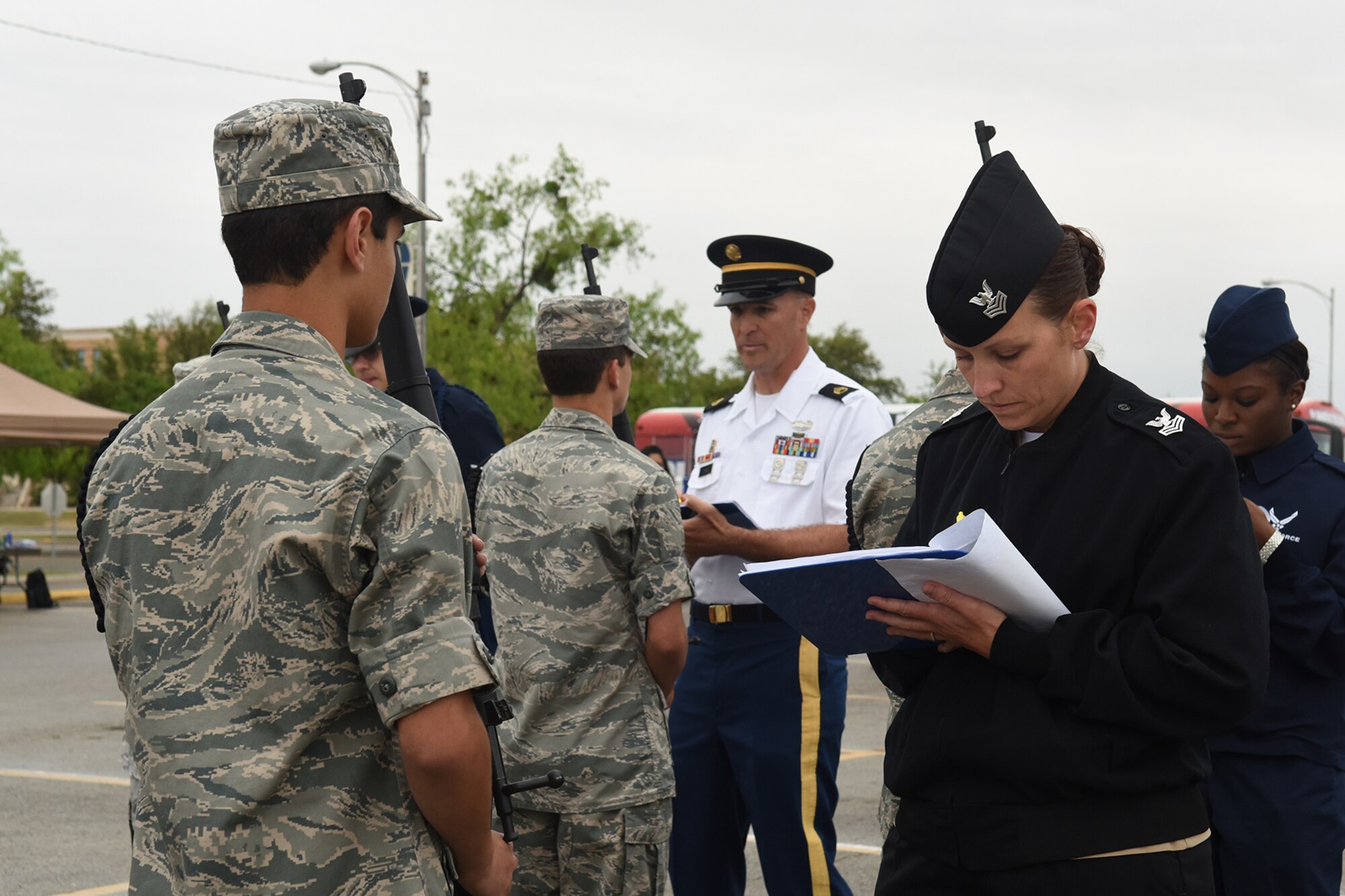 Goodfellow Air Force Base members inspect San Angelo Central High School Air Force Junior ROTC cadets during the 2016 Angelo State University ROTC Detachment 847, 18th Annual Drill Competition at ASU in San Angelo, Texas, April 9, 2016. During the inspection, judges deducted points for any uniform infractions or discrepancies. (U.S. Air Force photo by Staff Sgt. Laura R. McFarlane/Released)