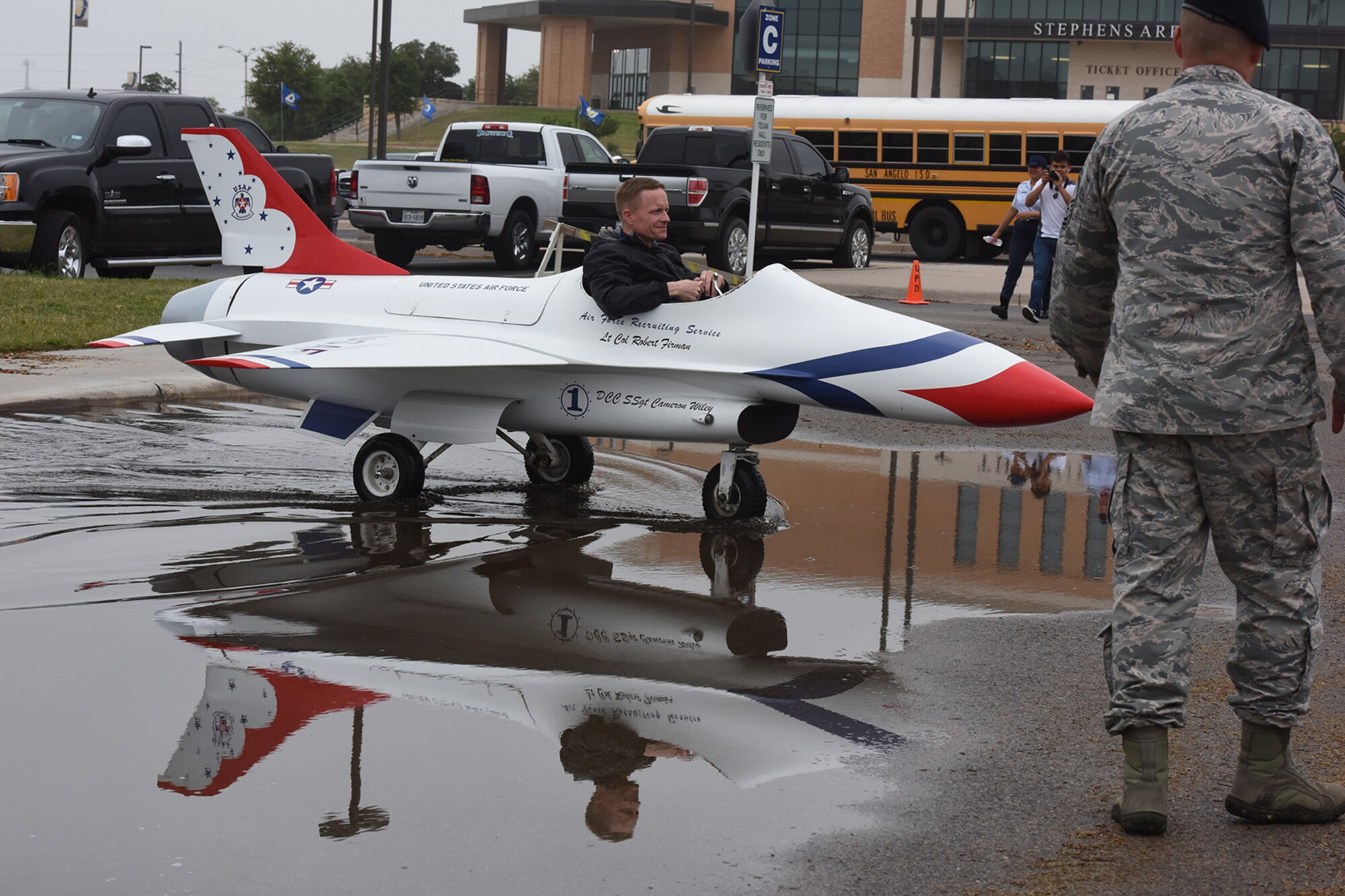 U.S. Air Force Lt. Col. Scott M. Partin, Angelo State University ROTC Detachment 847 Commander, drives an F16 mini jet Thunderbird from the 344th Recruiting Squadron during the 2016 ASU ROTC Detachment 847, 18th Annual Drill Competition at ASU in San Angelo, Texas, April 9, 2016. ASU raised the number of participants from almost 500 last year to 605 this year. (U.S. Air Force photo by Staff Sgt. Laura R. McFarlane/Released)