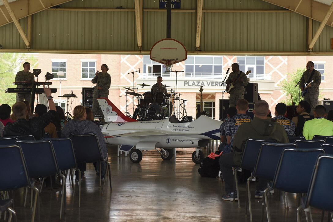 The U.S. Air Force Band of the West plays for a crowd at Angelo State University in San Angelo, Texas, April 9, 2016. The band played as part of the 18th Annual ASU ROTC Detachment 847 Drill Competition. (U.S. Air Force photo by Airman Chase Sousa/Released)