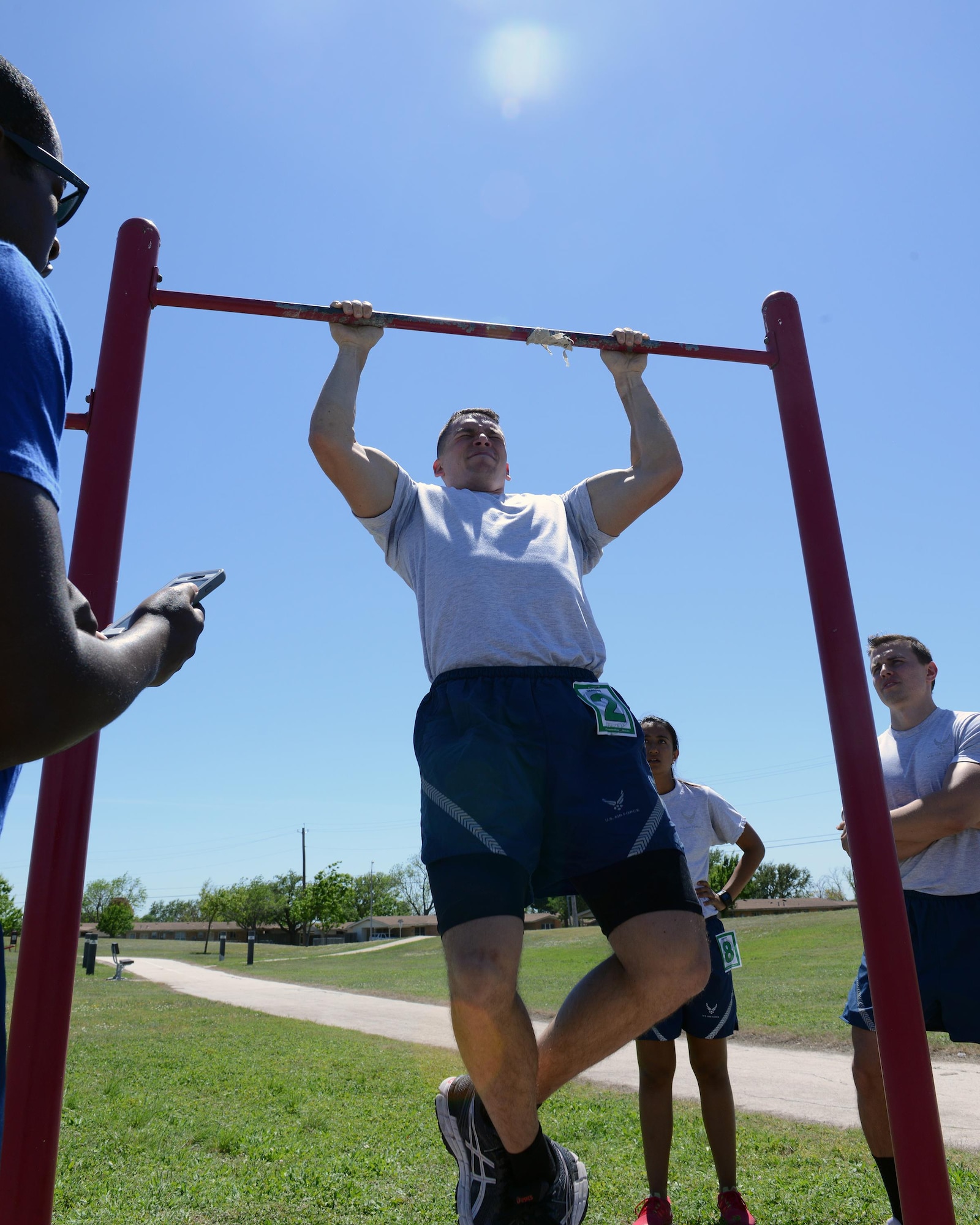2nd Lt. Kyle Flynn, 47th Student Squadron awaiting pilot training, performs pull-ups at Laughlin Air Force Base, Texas, April 5, 2016. One station during the Warrior Games involved calisthenics to include pull-ups, sit-ups and push-ups. (U.S. Air Force photo by Senior Airman Jimmie D. Pike)