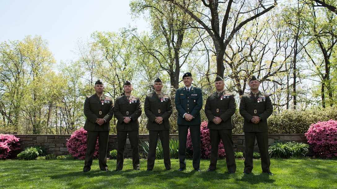 Left to right (CWO Jake Geary) (Maj. Michael Radynski) (Maj. Scott Benninghoff) (Gen. Peter Bartram) (Maj. Richard R. Schellhaas) (Maj. Justin Jones) Marines who were awarded the Defense Medal for Exceptionally Meritorious International Service pose for a picture with Gen. Peter Bartram the Chief of Defence of Denmark during their visit to the Danish embassy at Washington, D.C.  April, 13, 2016.