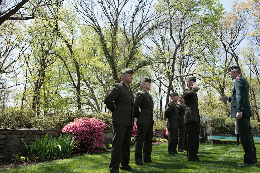 Marine Corps Major Scott Benninghoff salutes General Peter Bartran after receiving the Defence Medal of Exceptionally Meritorious International Service at the Danish embassy in Washington, D.C.  April, 13, 2016. General Peter Bartram is the only four star general in the Danish military.