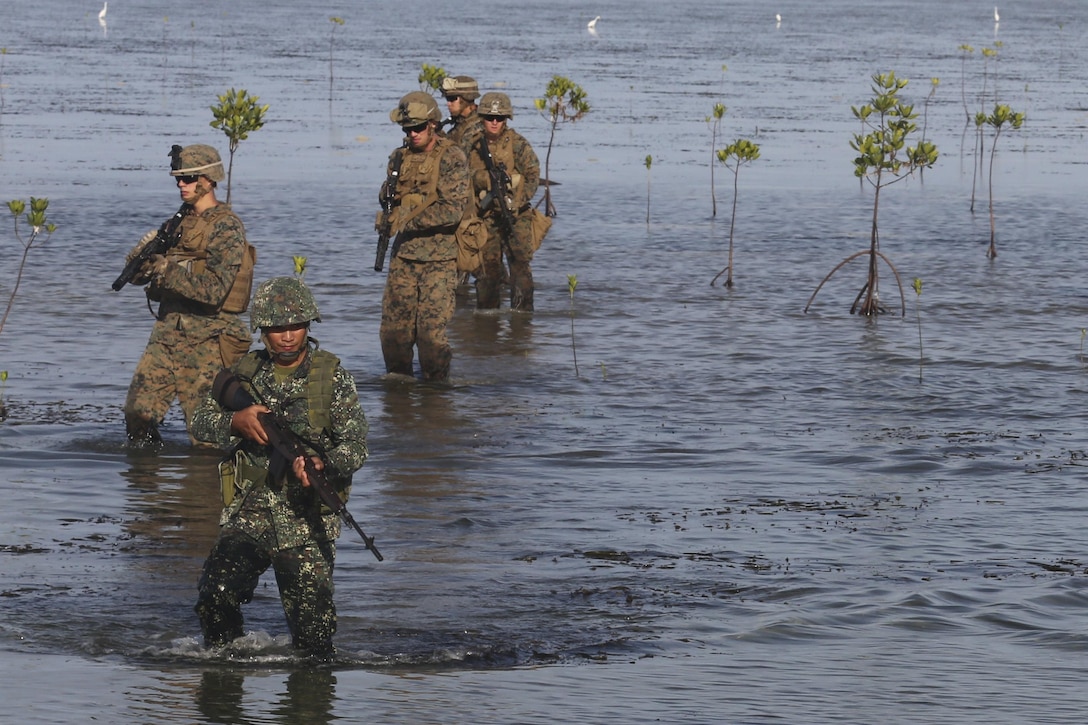 Marines patrol past mangroves in Puerto Princesa, Philippines, April 10, 2016, during Exercise Balikatan. The annual exercise aims to improve the ability of Philippine and U.S. military forces to work together during planning, contingency and humanitarian assistance and disaster relief operations. Marine Corps photo by Lance Cpl. Damon A. Mclean