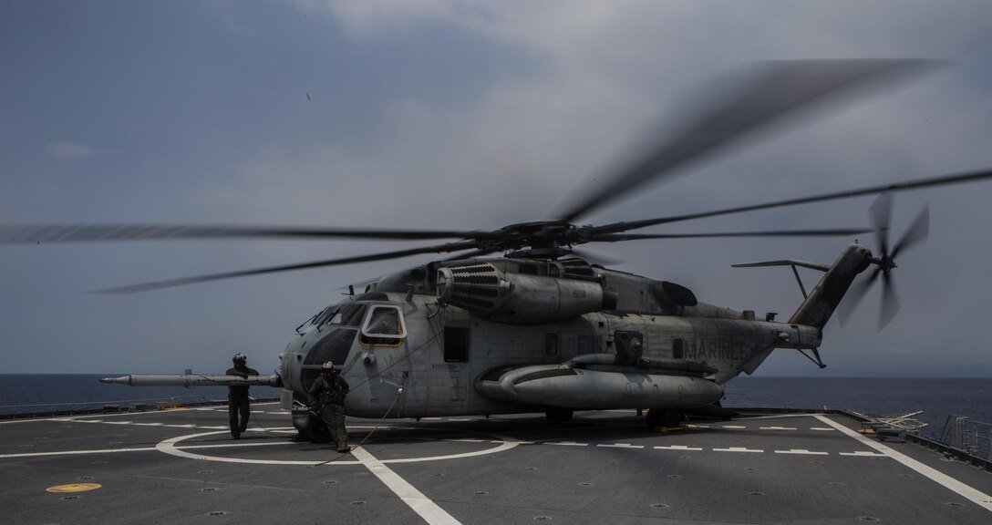A U.S. Marine Corps CH-53E Super Stallion helicopter, lands on the joint high speed vessel, the U.S.N.S. Millinocket during Balikatan 16, off the coast of Panay, Philippines, April 12, 2016. After landing on deck, infantry units with 2nd Battalion, 2nd Marine Regiment de-boarded the helicopter marking the completion phase of an aerial assault of Antique Airfield. Marines and Navy work together to increase our amphibious capabilities to be able to work effectively to provide relief and assistance in the event of natural disasters and other crises that threaten public safety and health across the Indo-Asia-Pacific region. (U.S. Marine Corps photo by Lance Cpl. Jessica N. Etheridge/released)