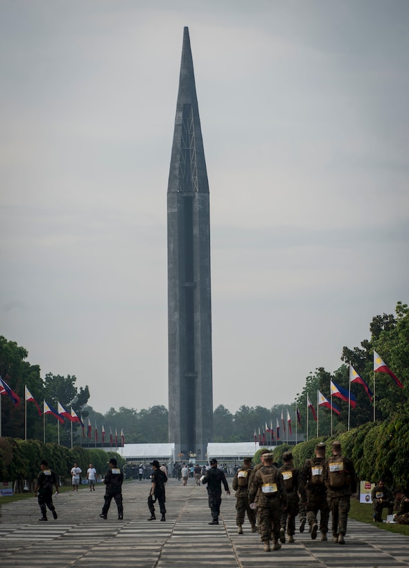 U.S. Marines walk to the Capas National Shrine during Balikatan 16 at Capas, Philippines, April 11, 2016. The shrine was built by the Philippine government as a memorial to Allied soldiers who died at Camp O'Donnell at the end of the Bataan Death March during the World War II. This year marks the 32nd iteration of Balikatan where U.S. service members continue to work “shoulder-to-shoulder” with members of the Armed Forces of the Philippines to increase combined readiness to crises and conflict across the Indo-Asia-Pacific region.