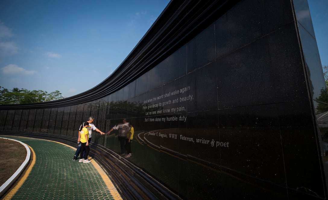 A Philippine family looks at the wall of names at the Capas National Shrine during Balikatan 16 Capas, Philippines, April 11, 2016.  The shrine was built by the Philippine government as a memorial to Allied soldiers who died at Camp O'Donnell at the end of the Bataan Death March during World War II. This year marks the 32nd iteration of Balikatan where U.S. service members continue to work “shoulder-to-shoulder” with members of the Armed Forces of the Philippines to increase combined readiness to crises and conflict across the Indo-Asia-Pacific region. 
