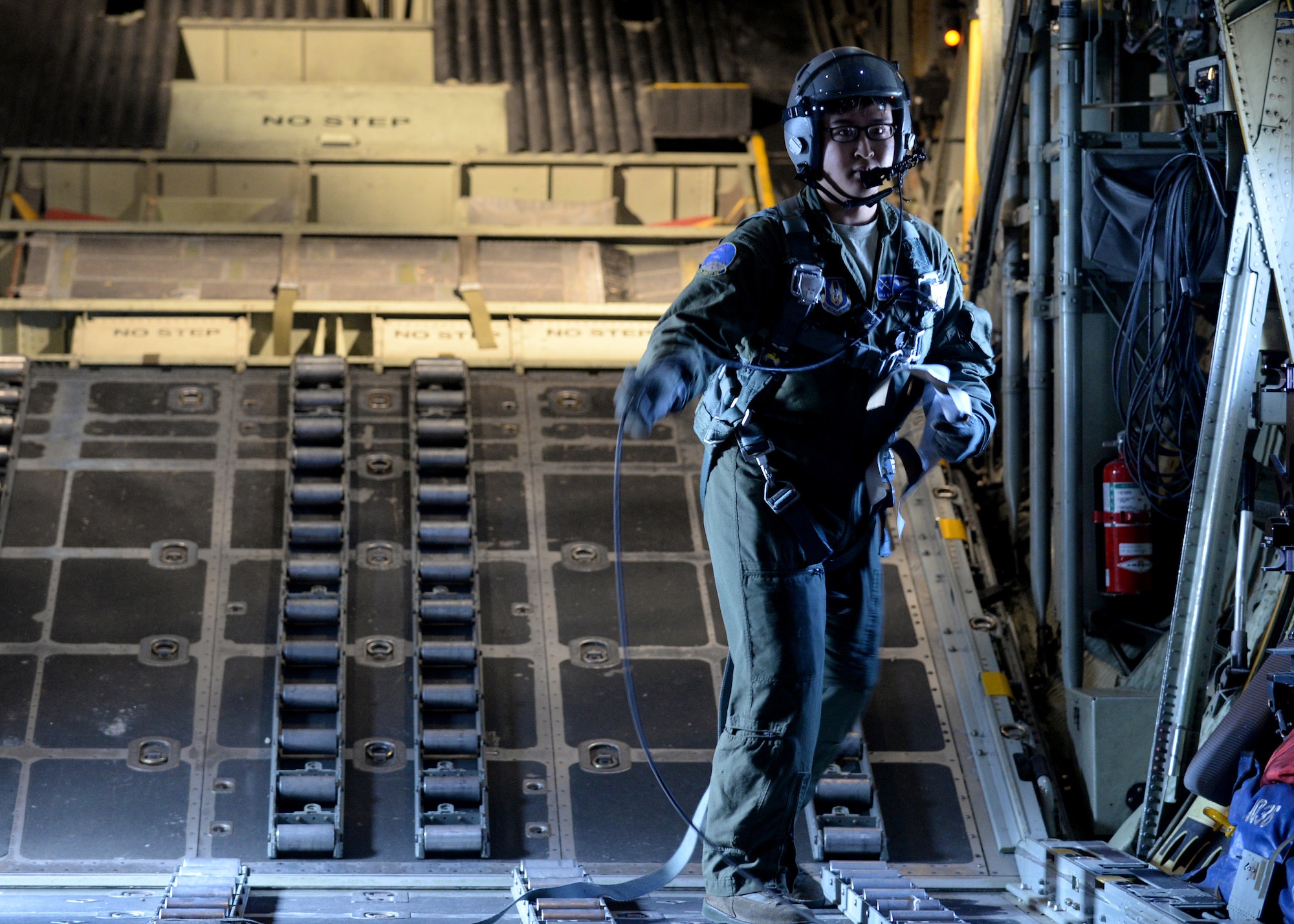 A U.S. Airman participates in a heavy drop exercise during Saber Junction 16, April 5, 2016, at Aviano Air Base, Italy. The exercise involved the 173rd Airborne Brigade and 16 allied and European nations conducting land operations in a joint, combined environment and to promote interoperability with participating nations. (U.S. Air Force photo by Airman 1st Class Cary Smith/Released)