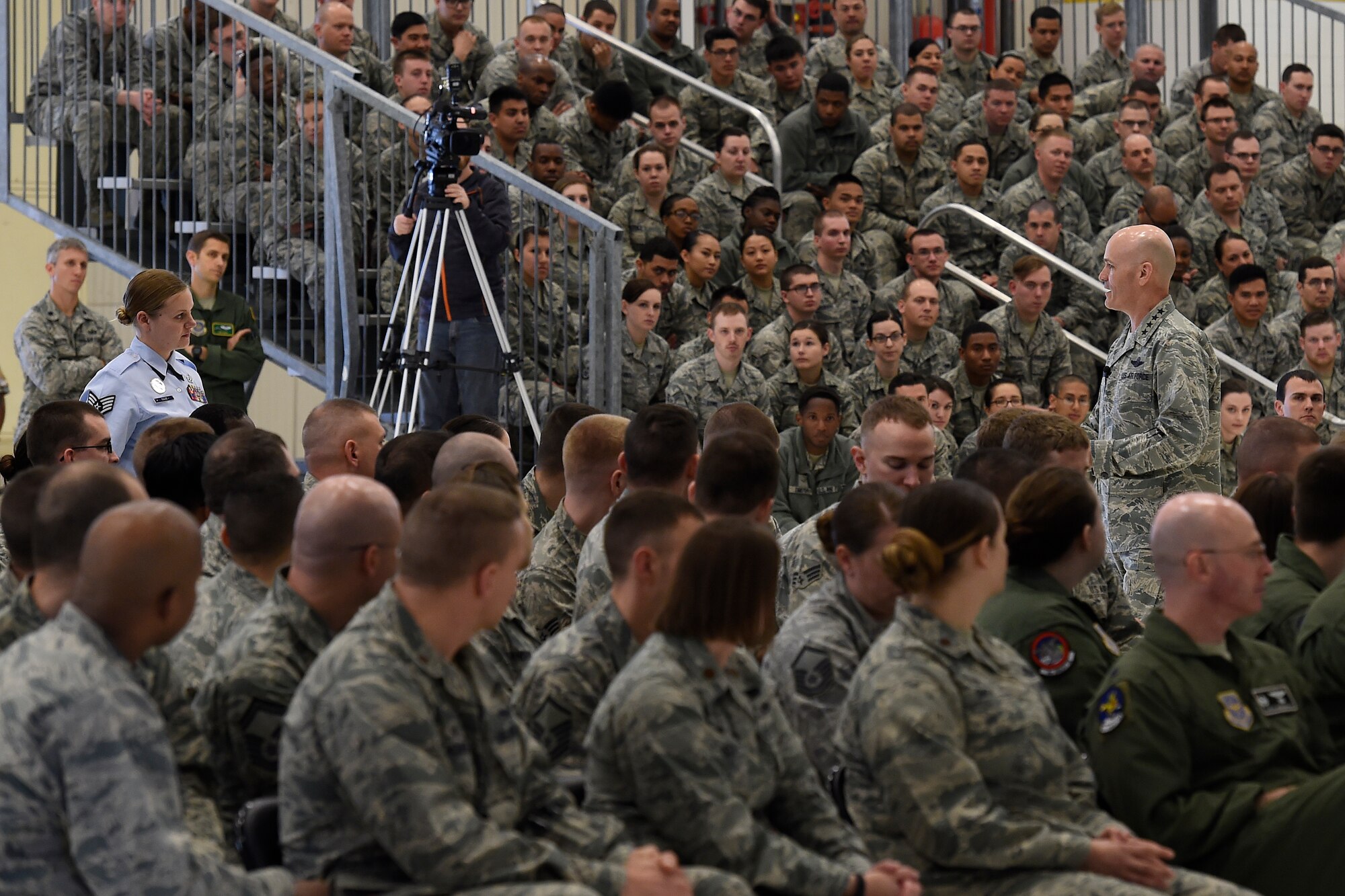 Staff Sgt. Jessica Raab, 62nd Airlift Wing Airmen Leadership School instructor asks Gen. Carlton D. Everhart II, Air Mobility Command commander, a question during an “All-Call” April 7, 2016 at Joint Base Lewis McChord. The All-Call was a chance for Everhart and Chief Master Sgt. Shelina Frey, AMC command chief, to speak to all of Team McChord Airmen at one time about several topics including manning levels, the new Enlisted Performance Reports and the importance of the mission at McChord Field. (U.S. Air Force photo/Tech. Sgt. Tim Chacon)
