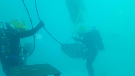 U.S. Army divers with the 569th Engineer Dive Detachment train with lift bags at Fort Eustis, Va., March 7, 2016. The divers use the bags to lift heavy objects out of water during construction, demolition and salvage missions. (U.S. Army courtesy photo) 