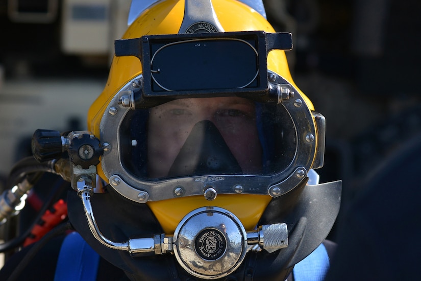 U.S. Army Spc. David Plummer, a second class diver assigned to the 569th Engineer Dive Detachment, prepares to surface-dive into the James River at Fort Eustis, Va., March 22, 2016. Plummer conducted a surface dive as part of upgrade training to become a salvage diver. (U.S. Air Force photo by Staff Sgt. Natasha Stannard)