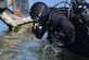 U.S. Army Sgt. Gordon Yeaple, a salvage diver assigned to the 569th Engineer Dive Detachment, jumps into the James River at Fort Eustis, Va., March 18, 2016. Army divers support joint and coalition marine missions by conducting reconnaissance, security and engineering surveys as well as underwater construction and demolition. (U.S. Air Force photo by Staff Sgt. Natasha Stannard)