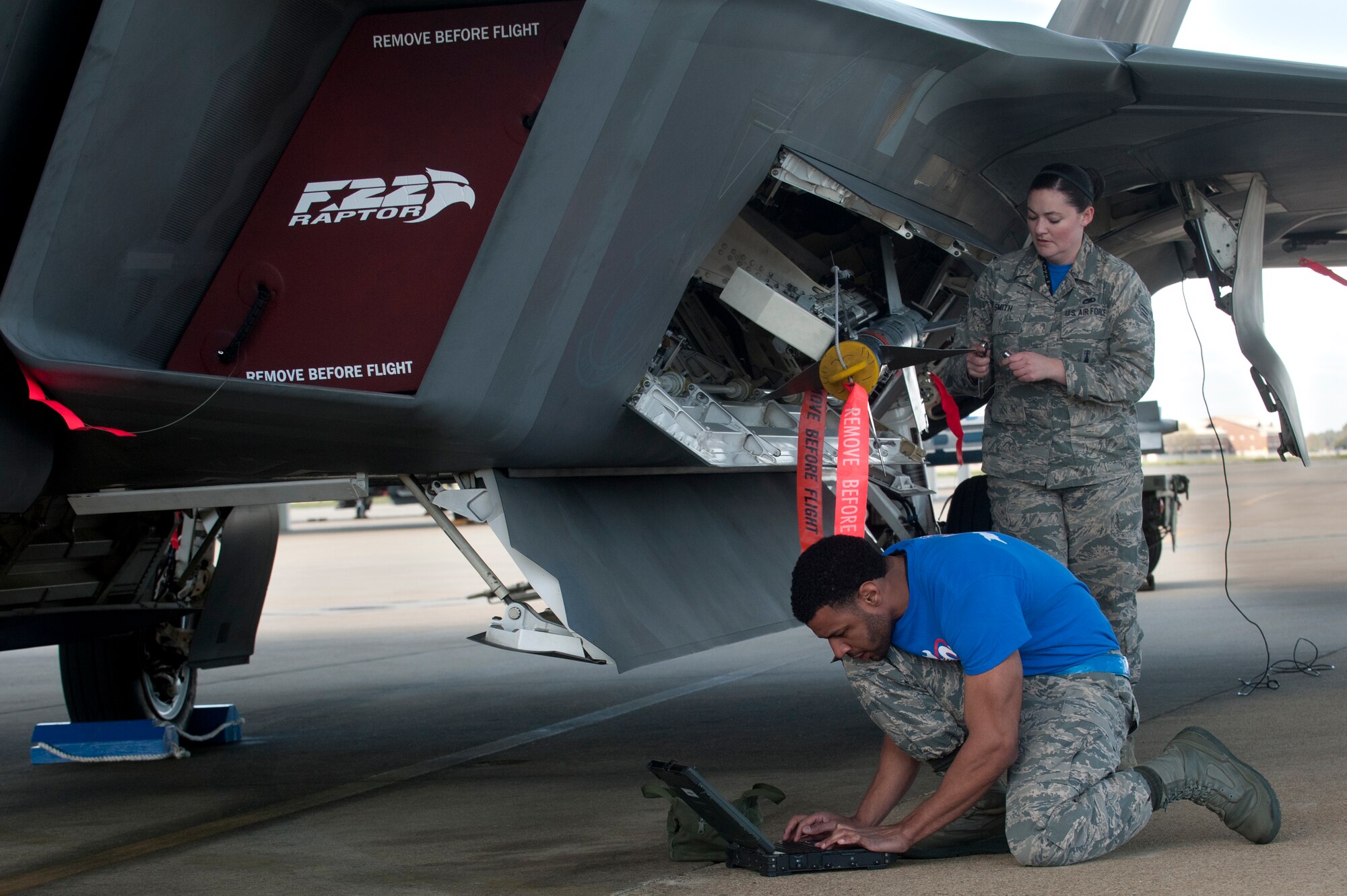 Members of the 94th Aircraft Maintenance Unit weapons load crew compete during the Second Quarter Weapons Load competition at Langley Air Force Base, Va., April 8, 2016. The 94th AMU won the competition, beating out the 27th AMU team for the quarterly award. (U.S. Air Force photo by Senior Airman R. Alex Durbin/Released)